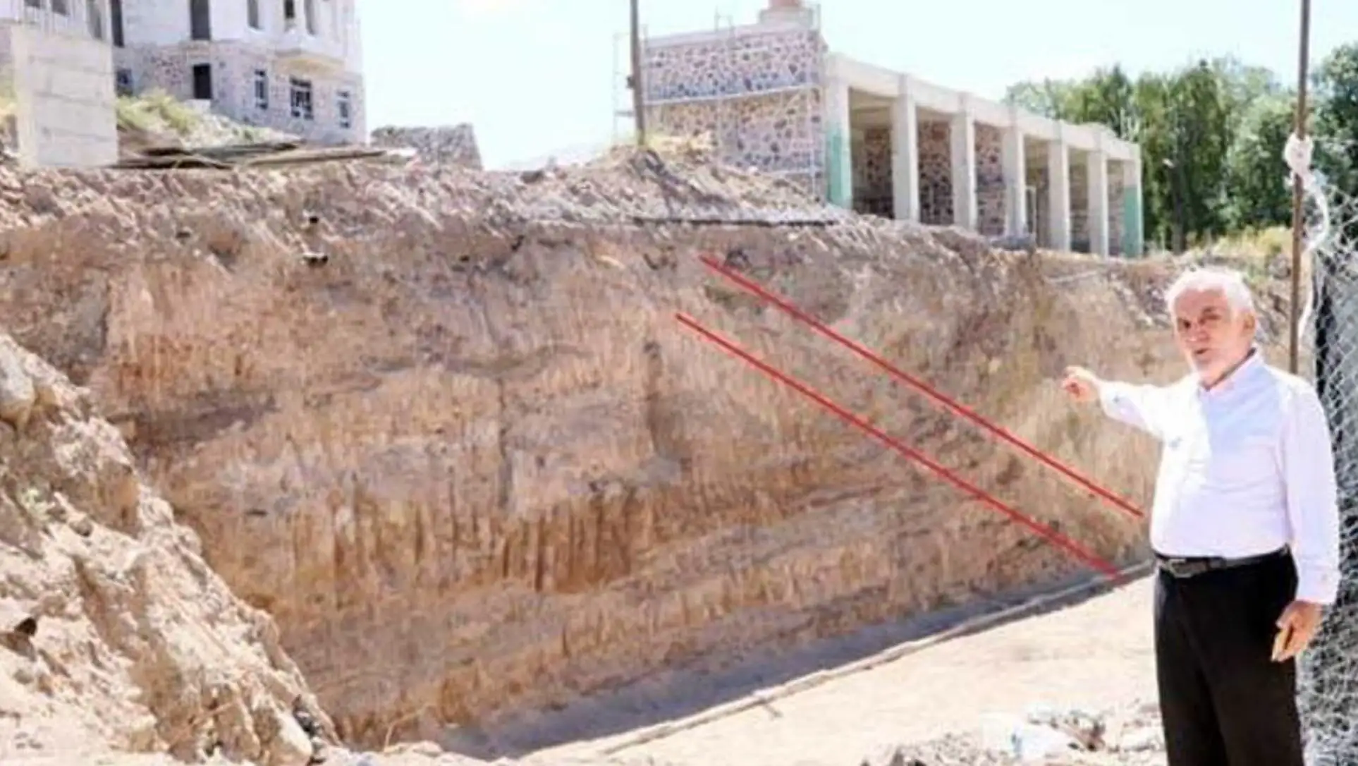 Dr. Mehmet Salih Bayraktutan pointing at the fault line.