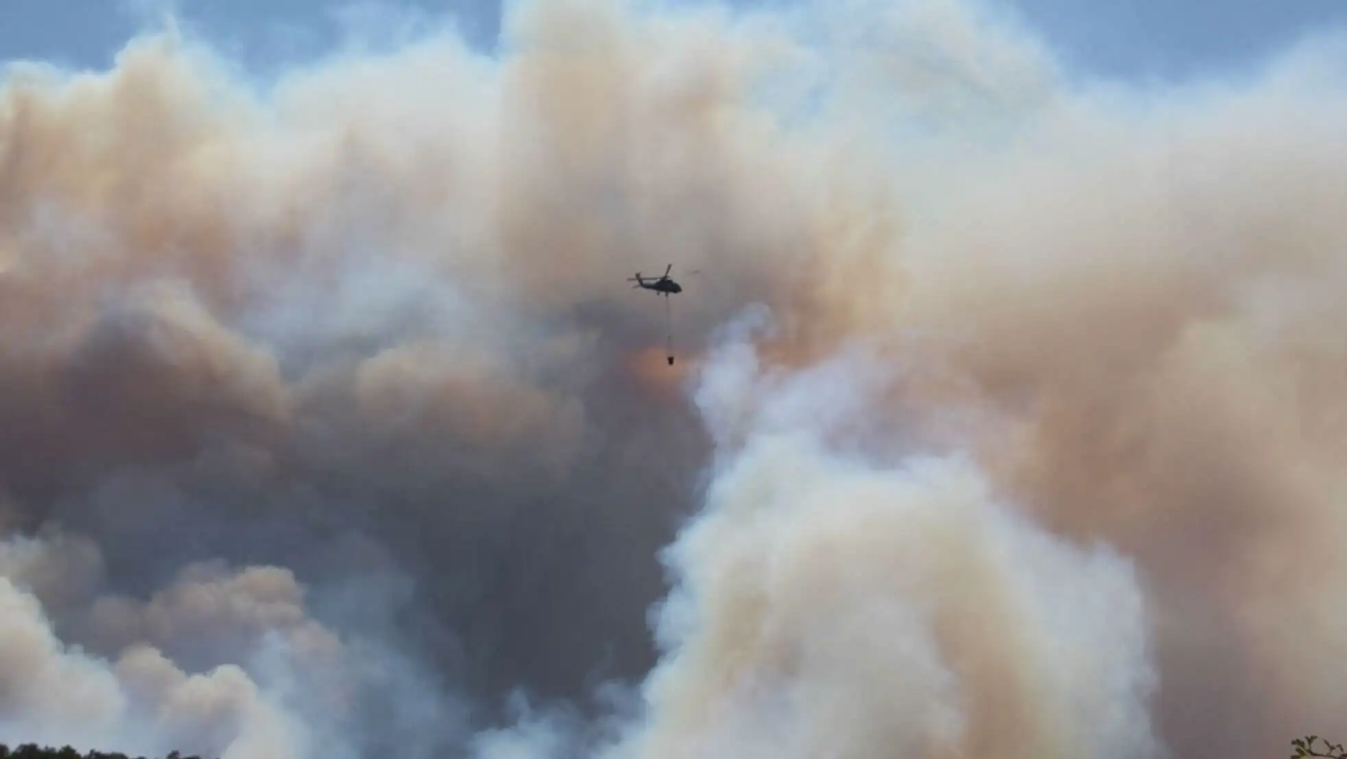 Moments of helicopter intervention during a forest fire. Moments of helicopter intervention during a forest fire.