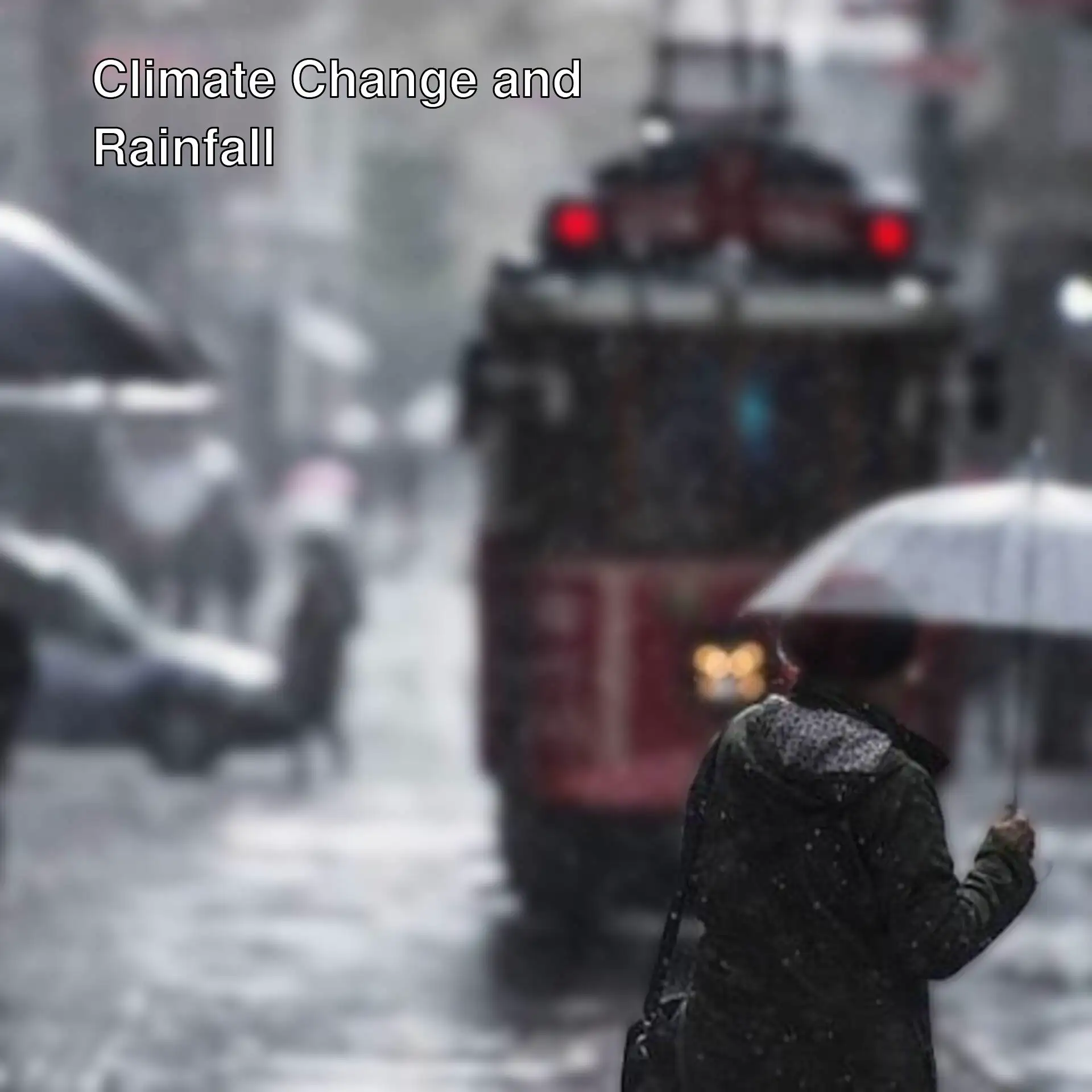 A person holding an umbrella in the rain. A person holding an umbrella in the rain.