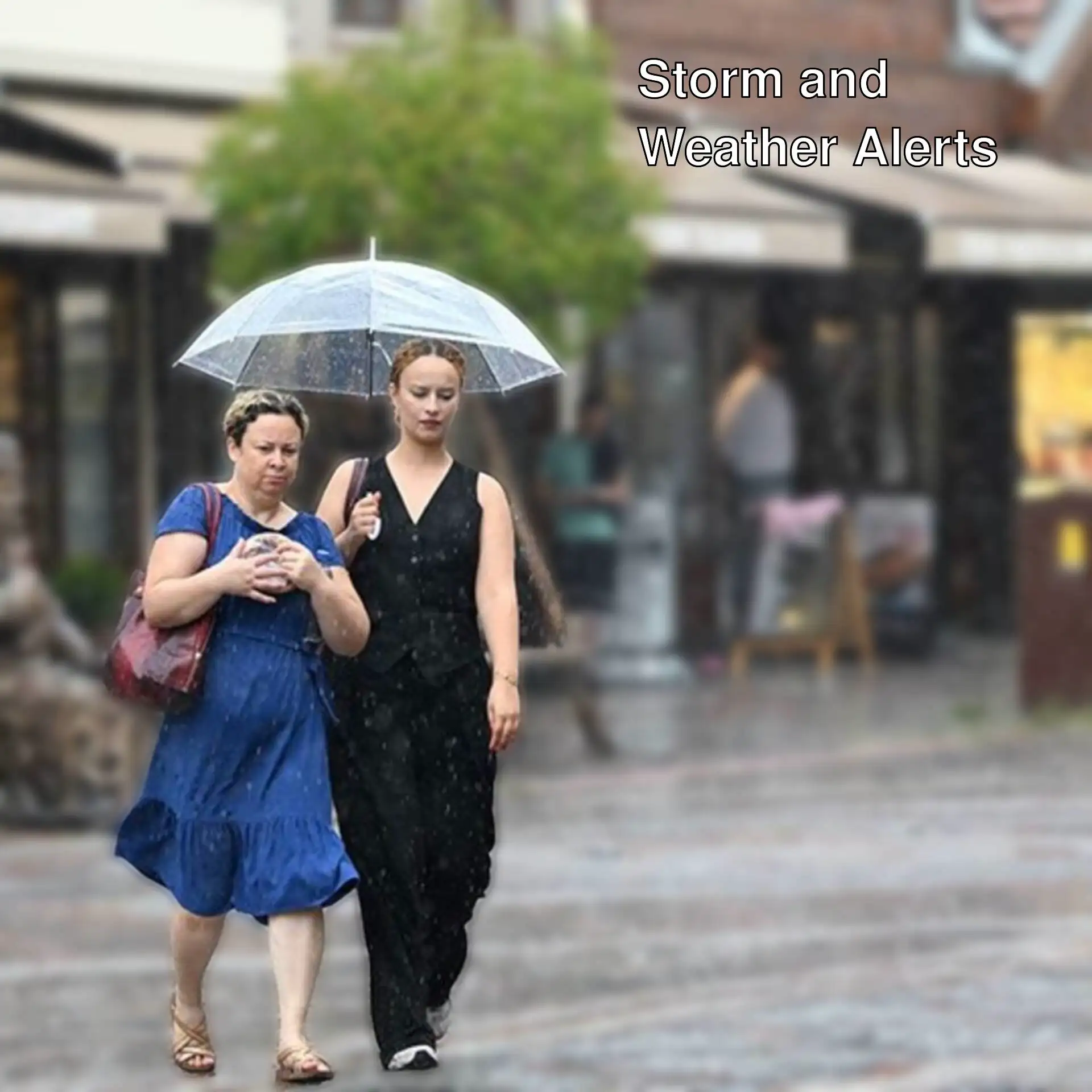 Two women walking in the rain. Two women walking in the rain.