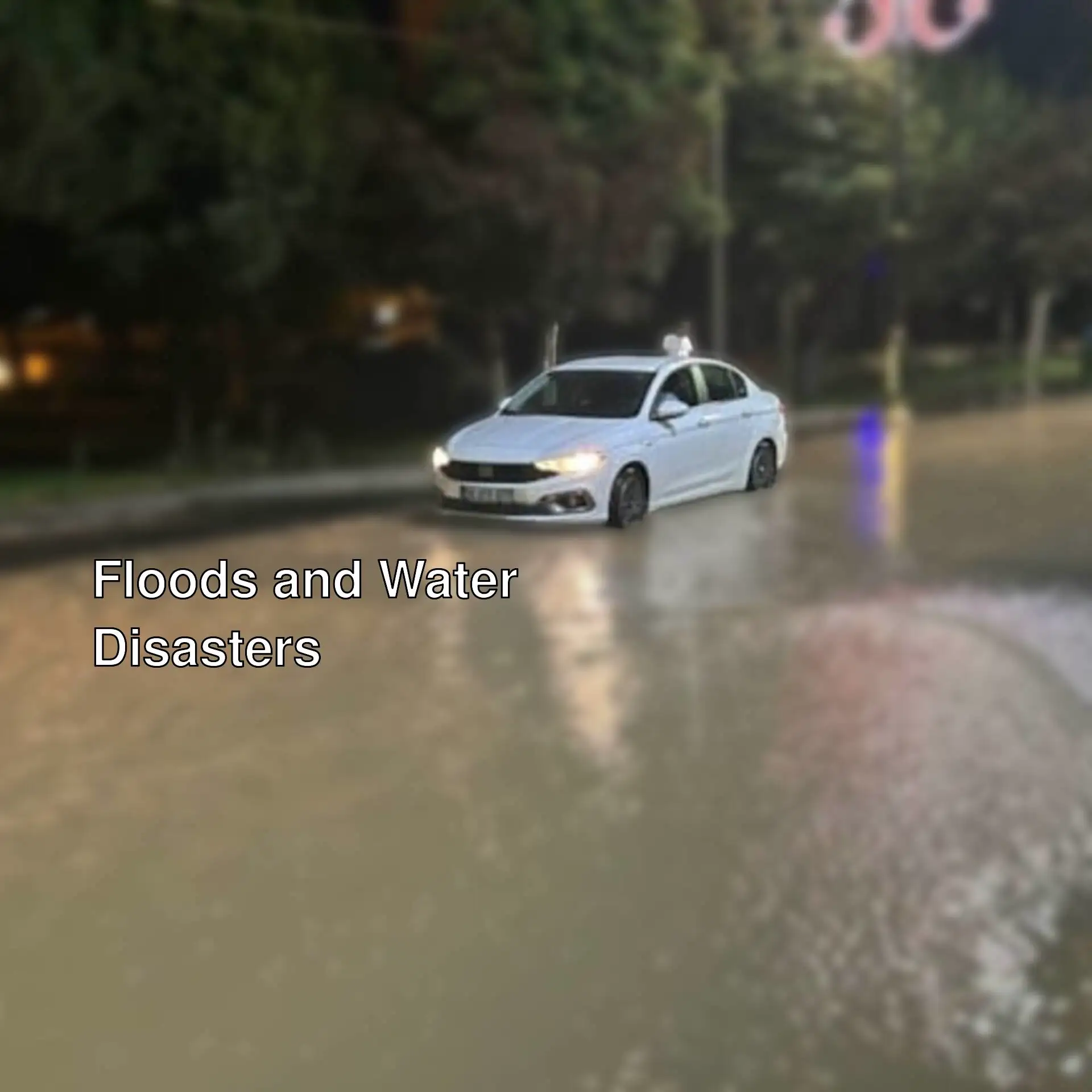 A car driving through a flooded street. A car driving through a flooded street.