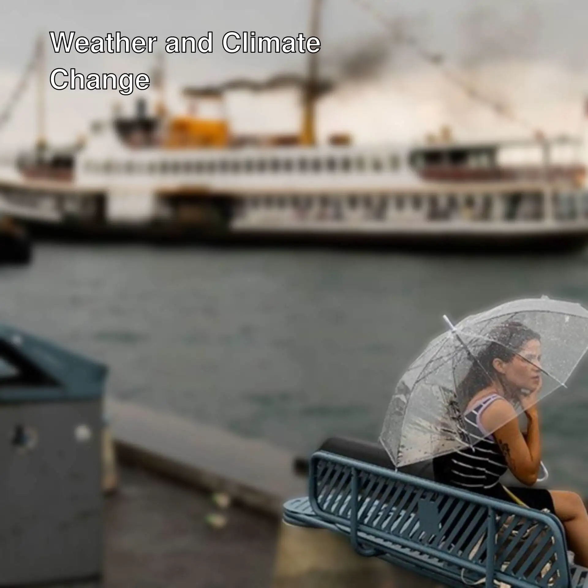 A woman sitting with an umbrella in front of a boat.