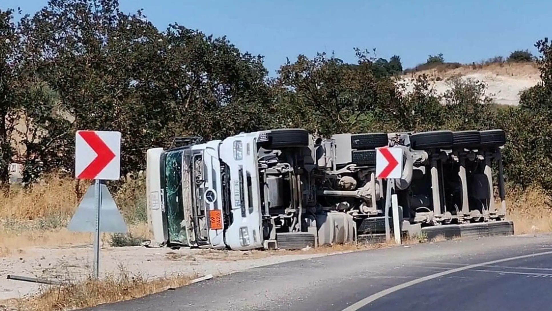 The overturned tanker on the road. The ammonium nitrate loaded tanker had an accident.