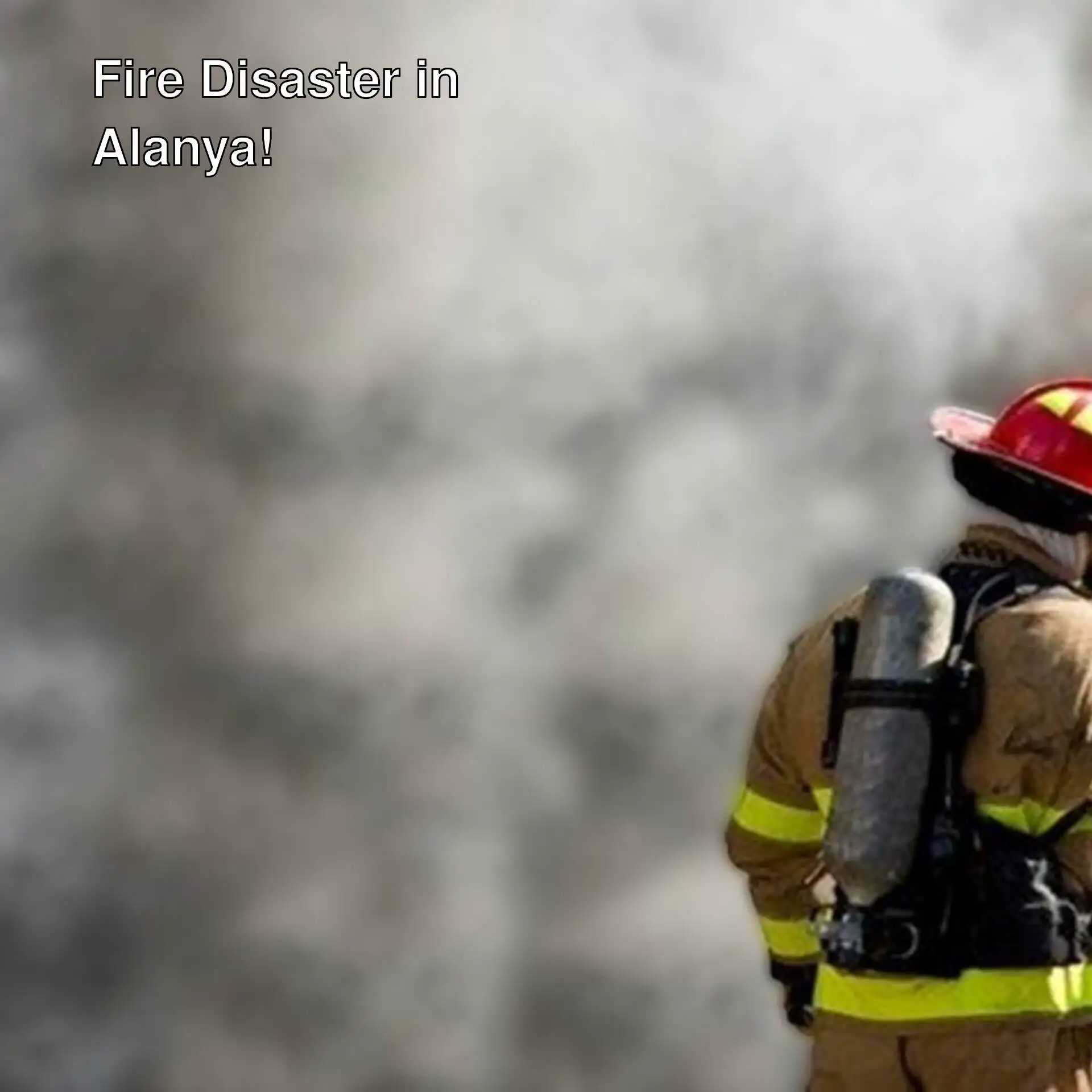 A firefighter in a fire suit.