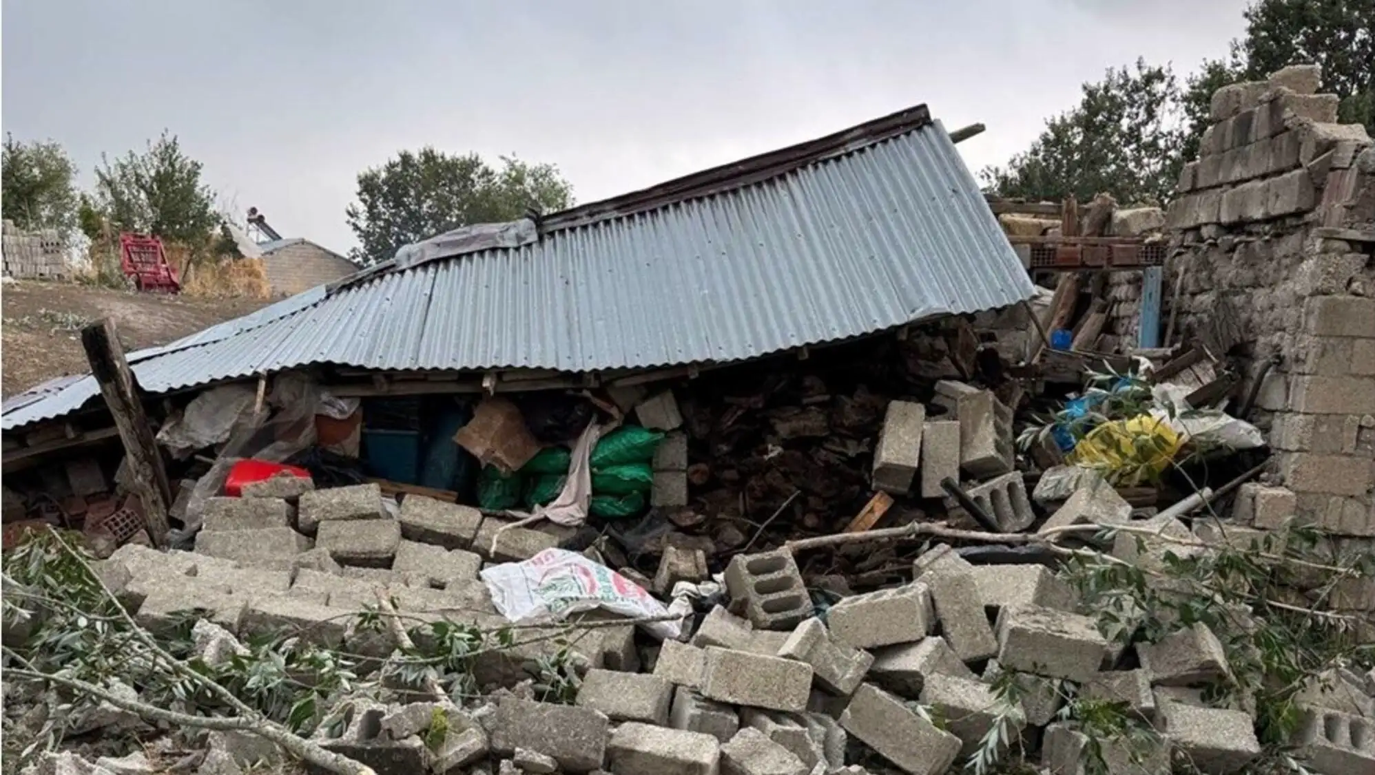 Roof parts from a building fell onto the road.