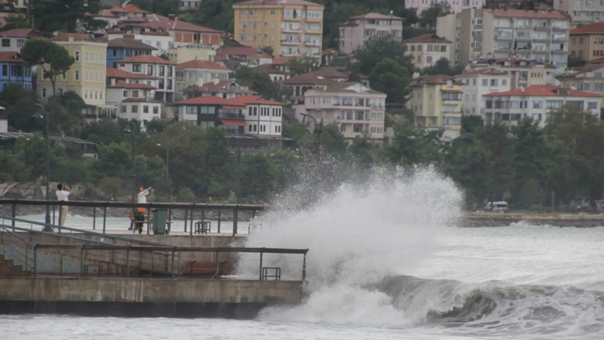 Moments of large waves crashing against the pier.
