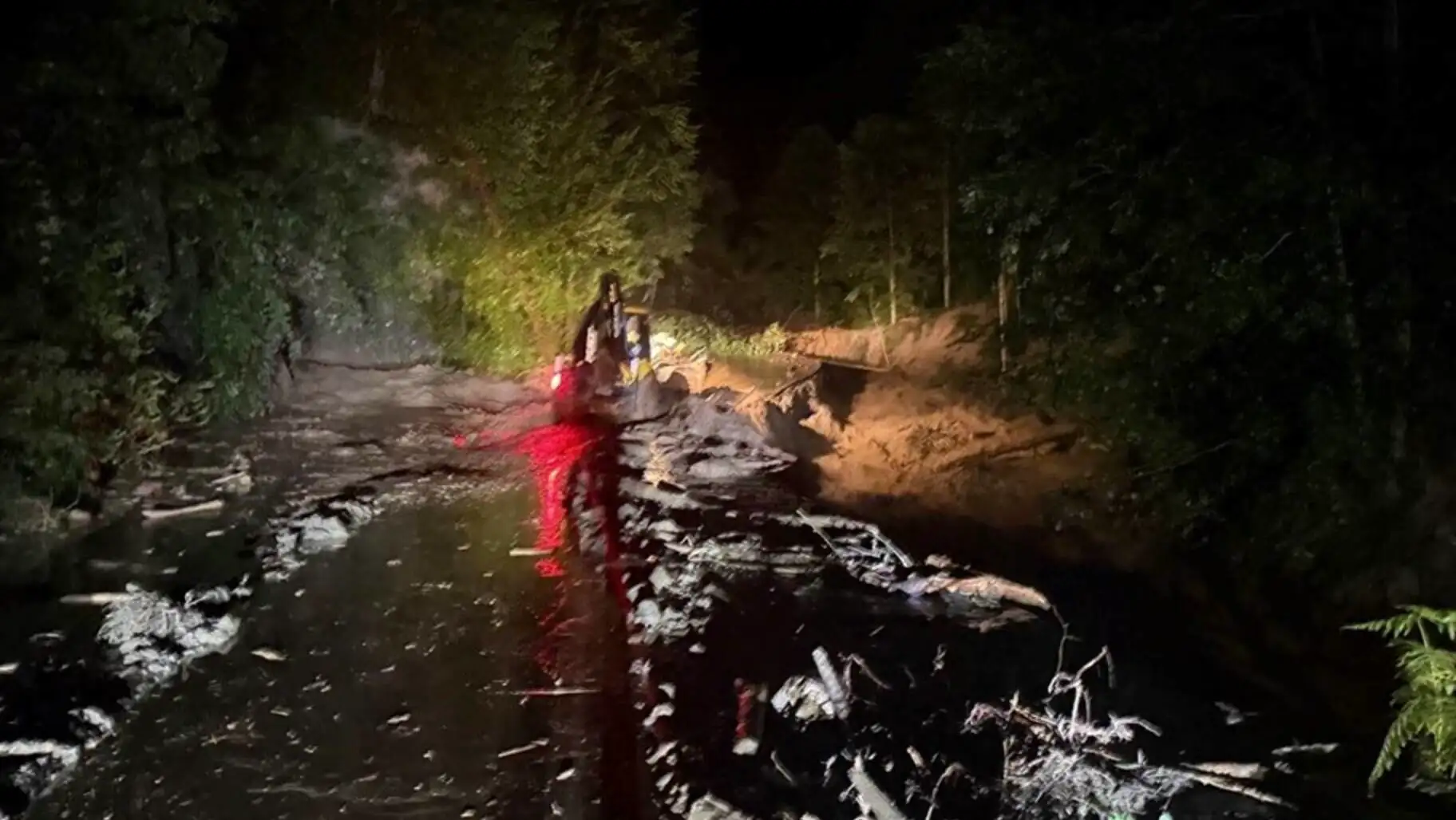 A person standing in a muddy area in Rize.