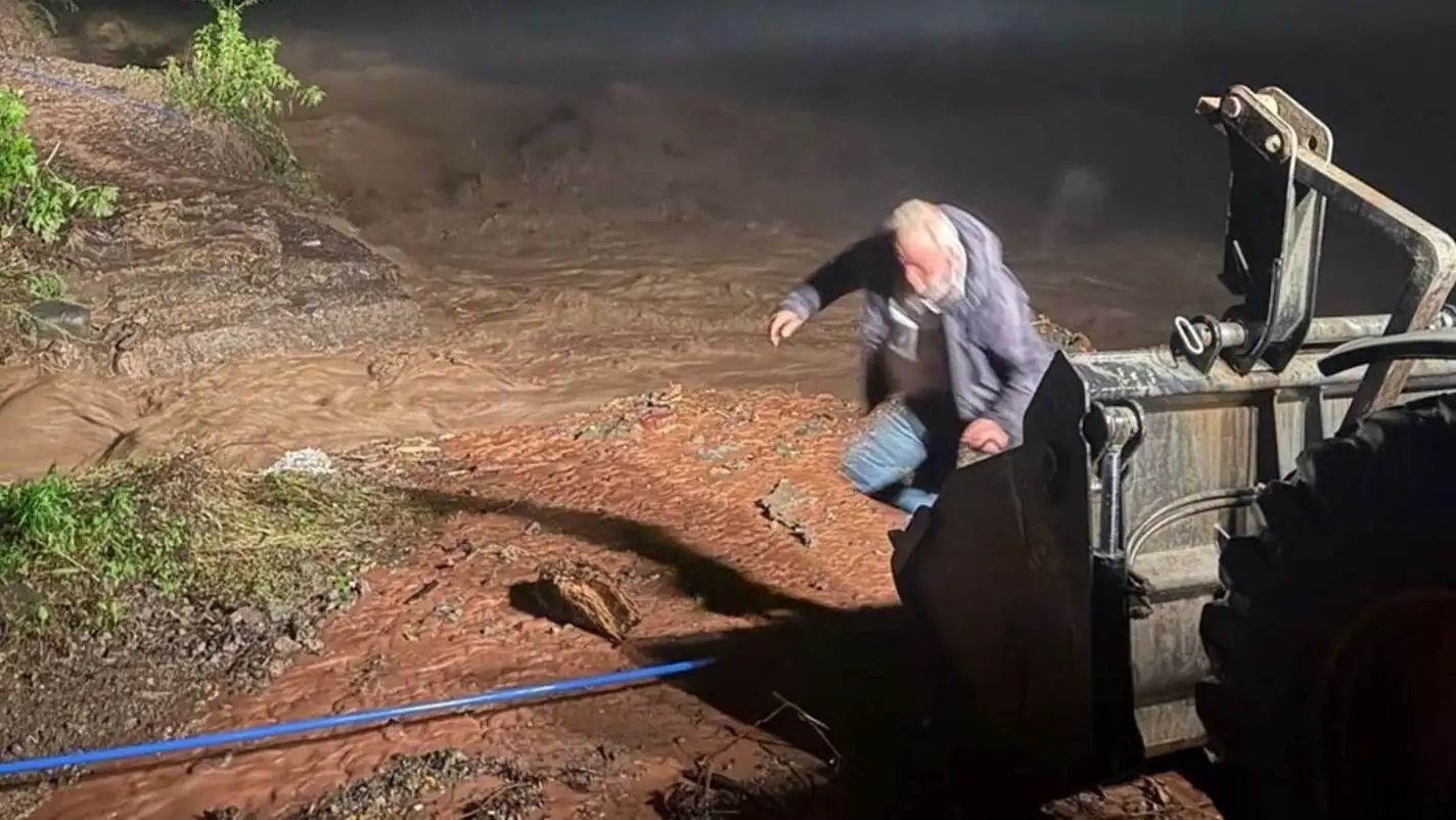 A man standing on a landslide road in Rize.