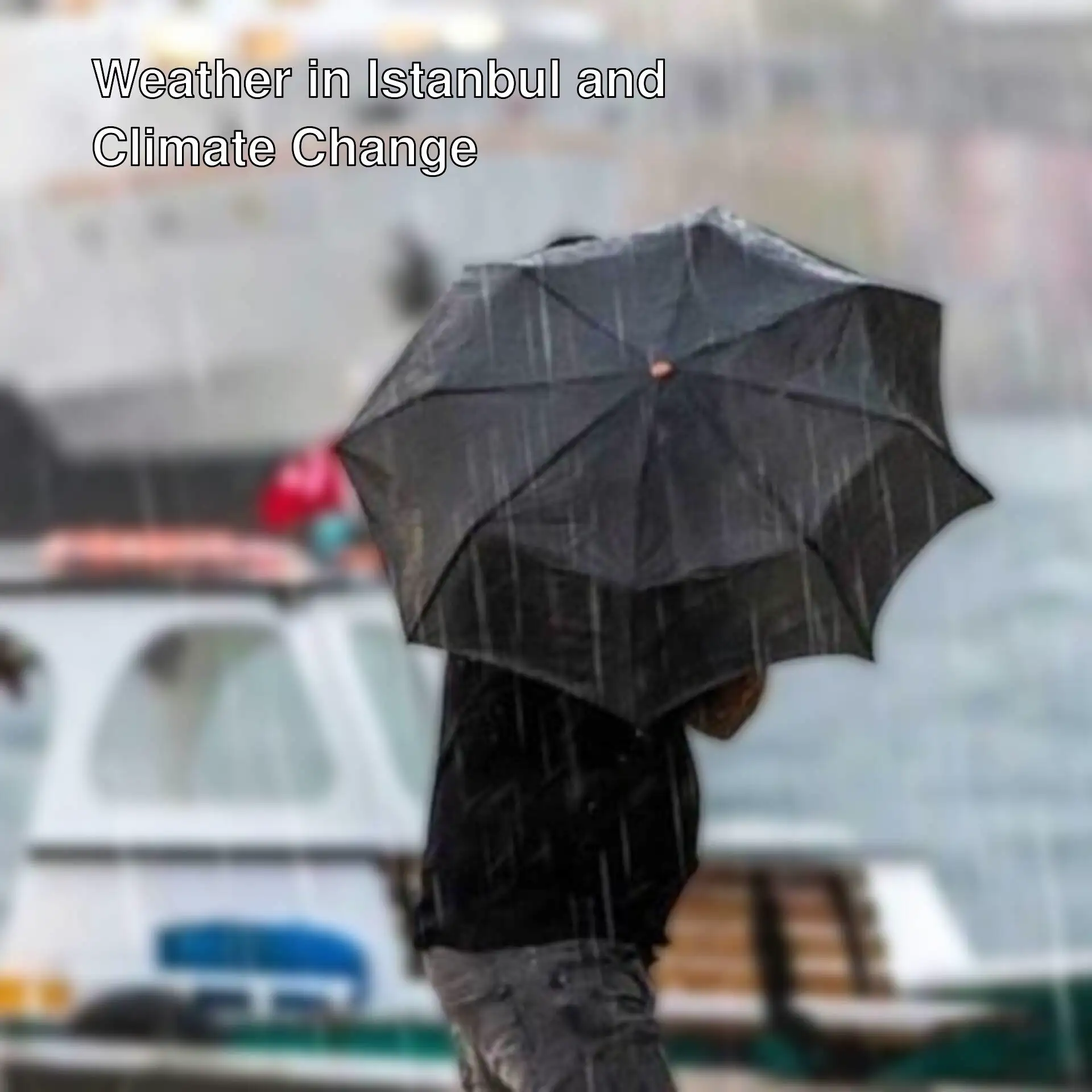 A person holding an umbrella in the rain.
