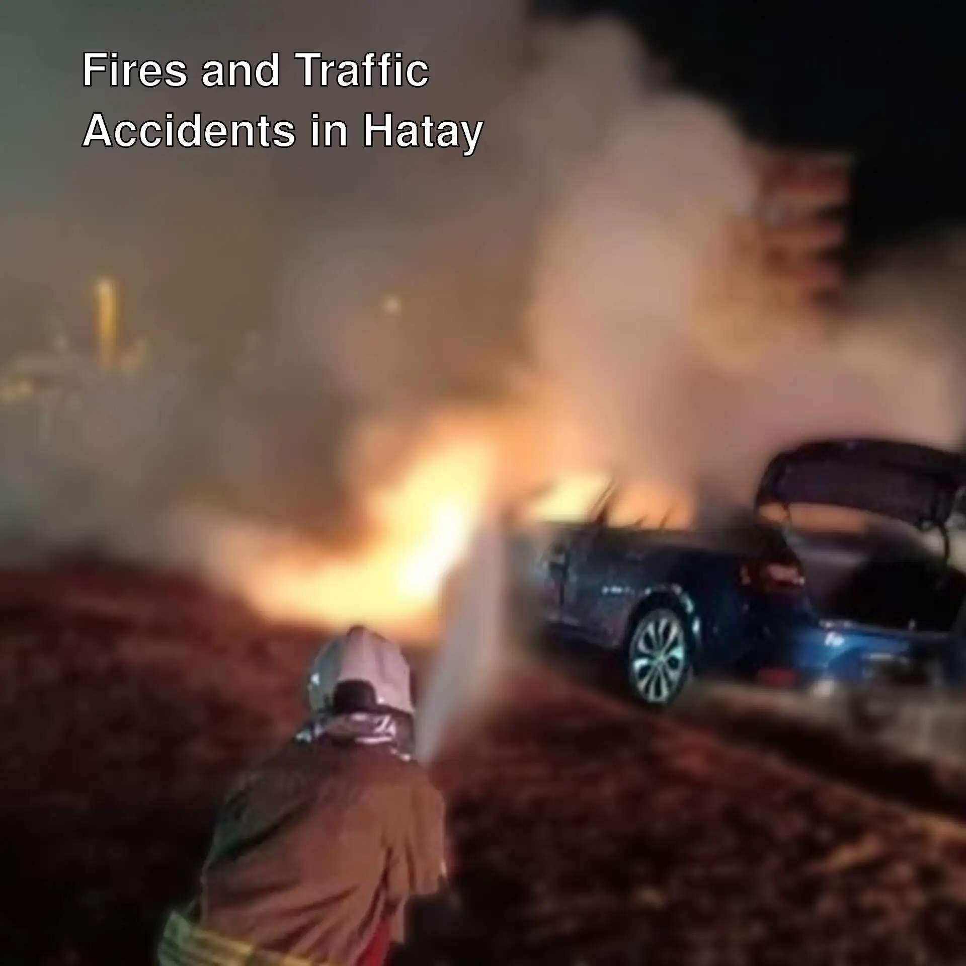 A fire being extinguished on a car A fire being extinguished on a car