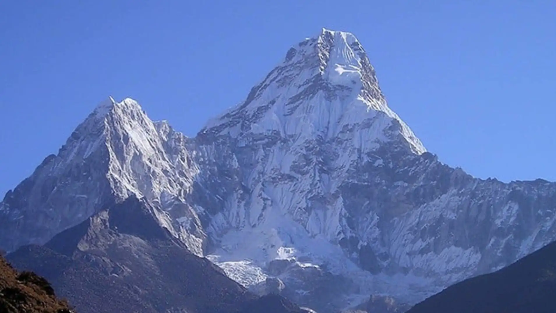 The snow-covered summit of Everest. The snow-covered summit of Everest.