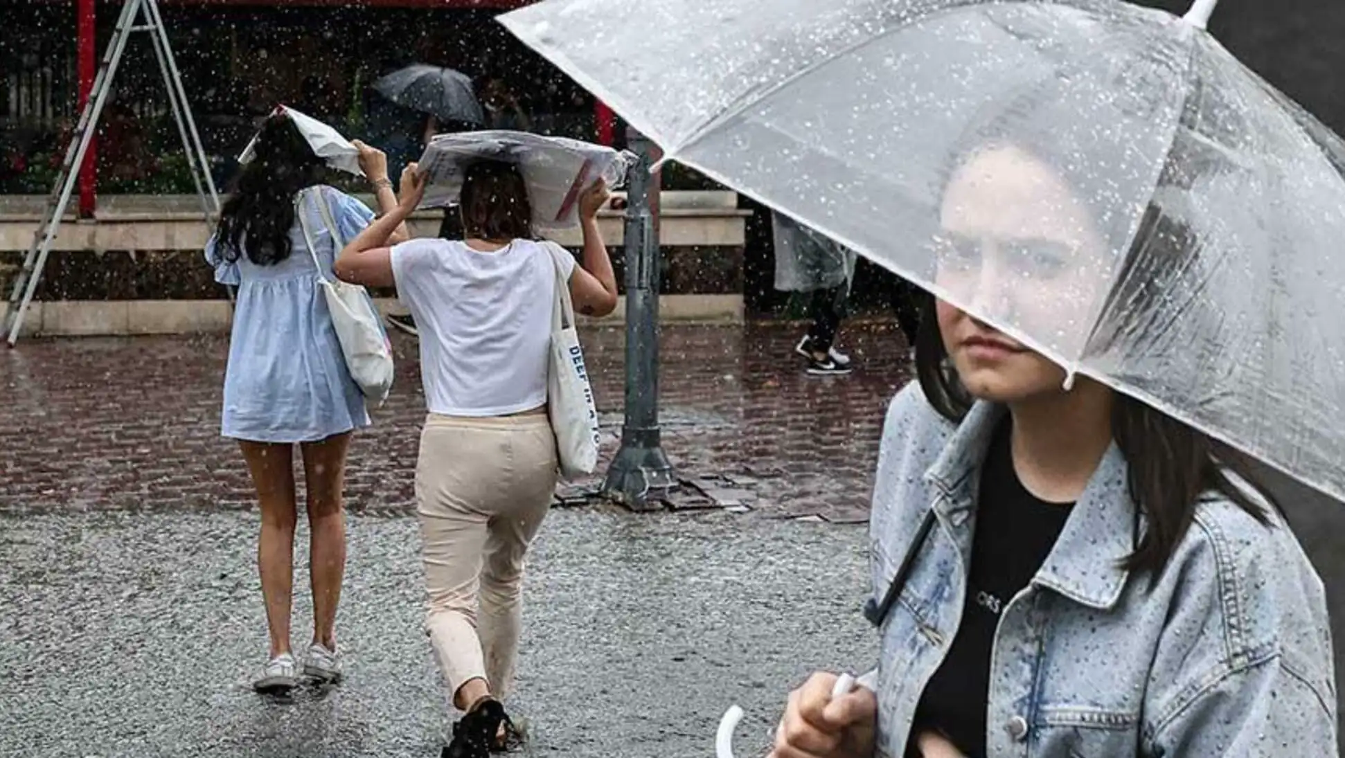 Women walking in the rain.