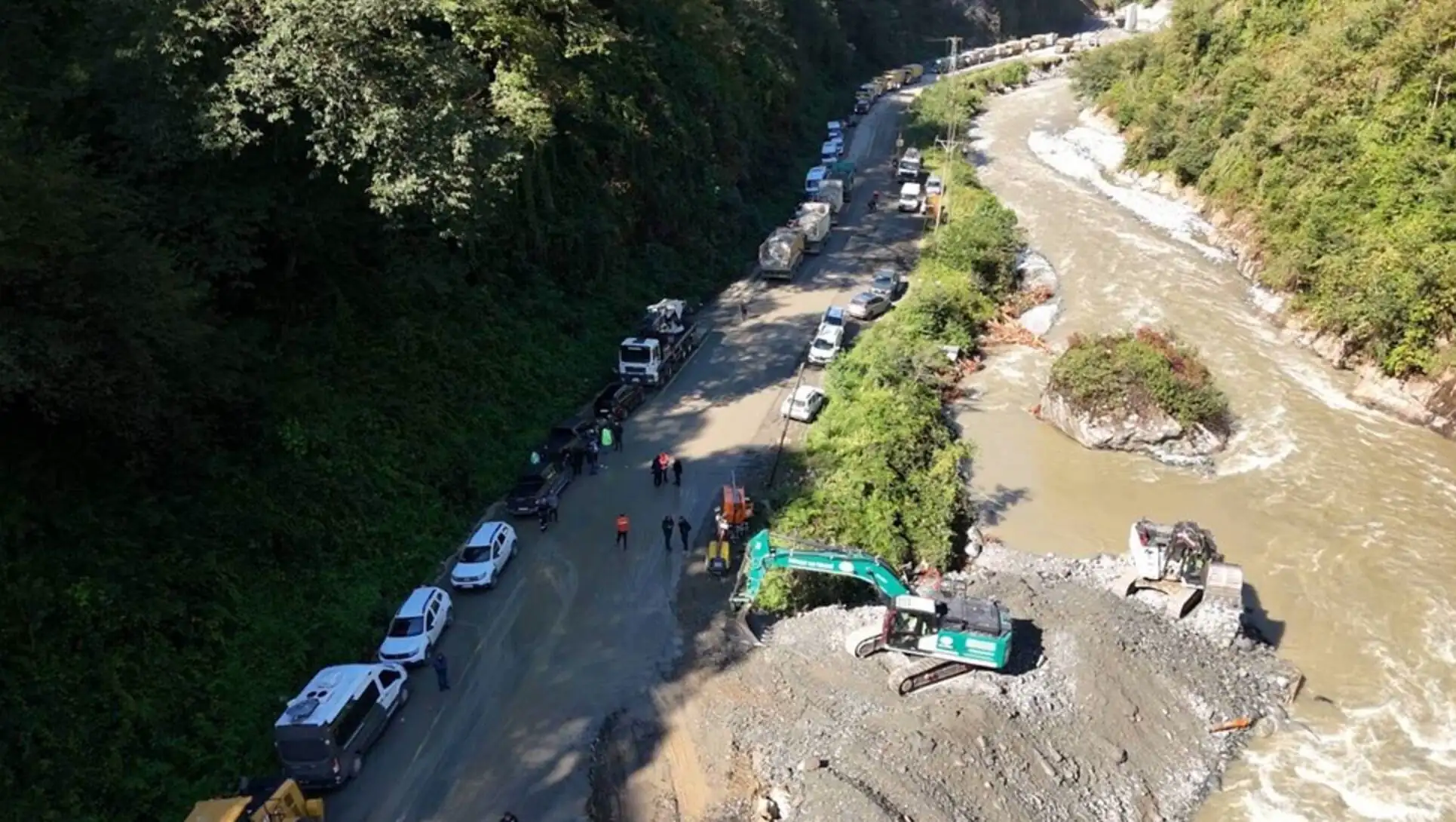 A road with cars and trucks on it.
