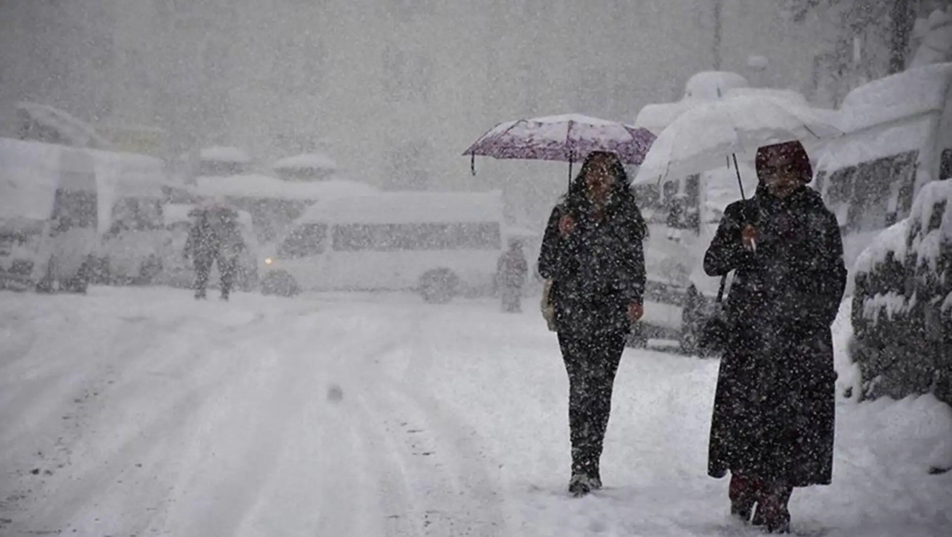 A group of people walking in the snow. A group of people walking in the snow.