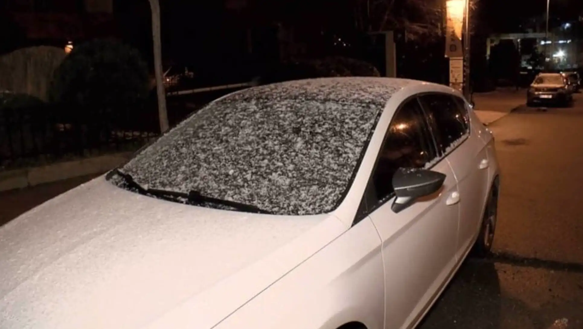 A car covered in snow. A car covered in snow.