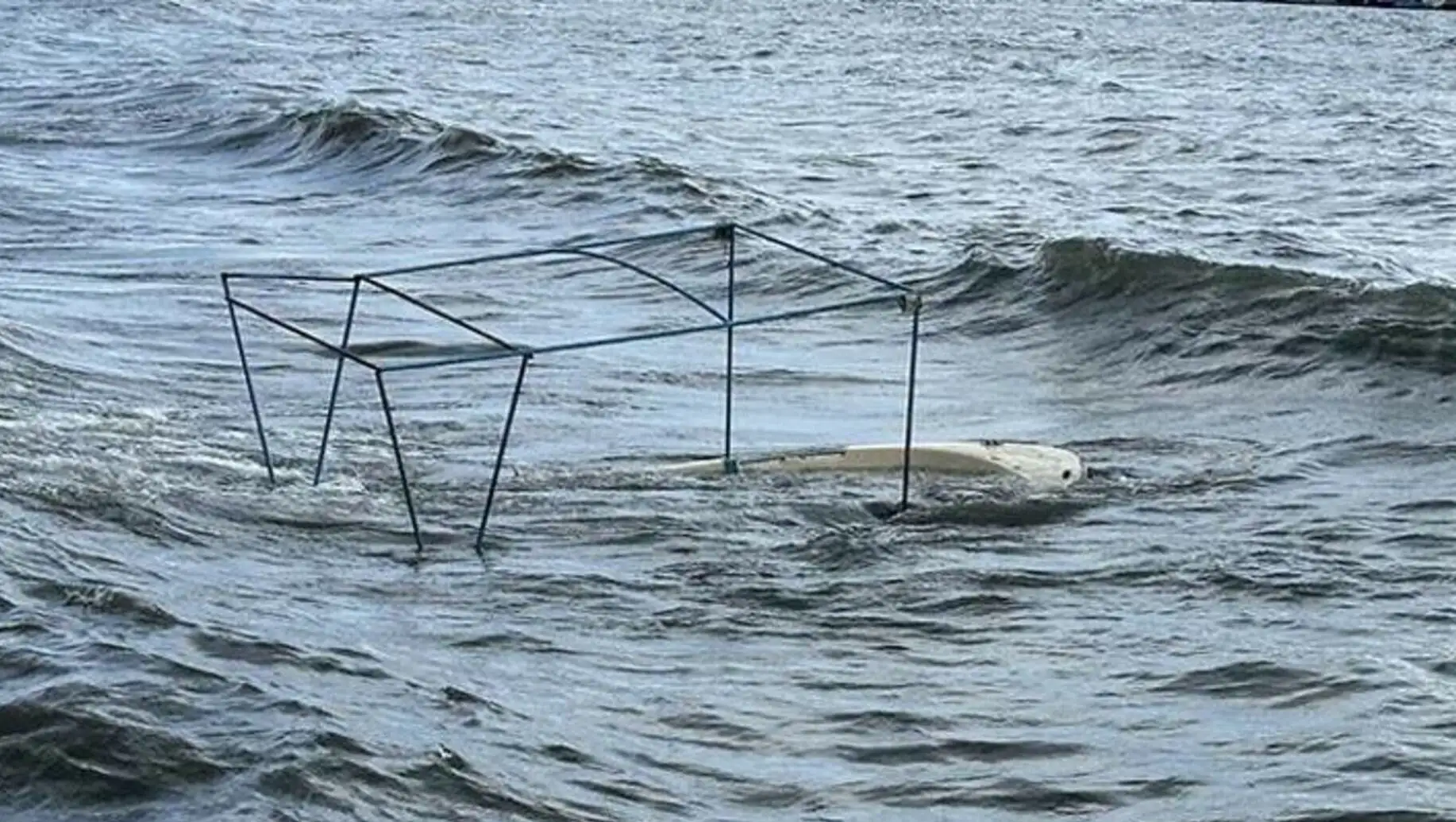 Fishermen battling the waves on their boats. Fishermen battling the waves on their boats.