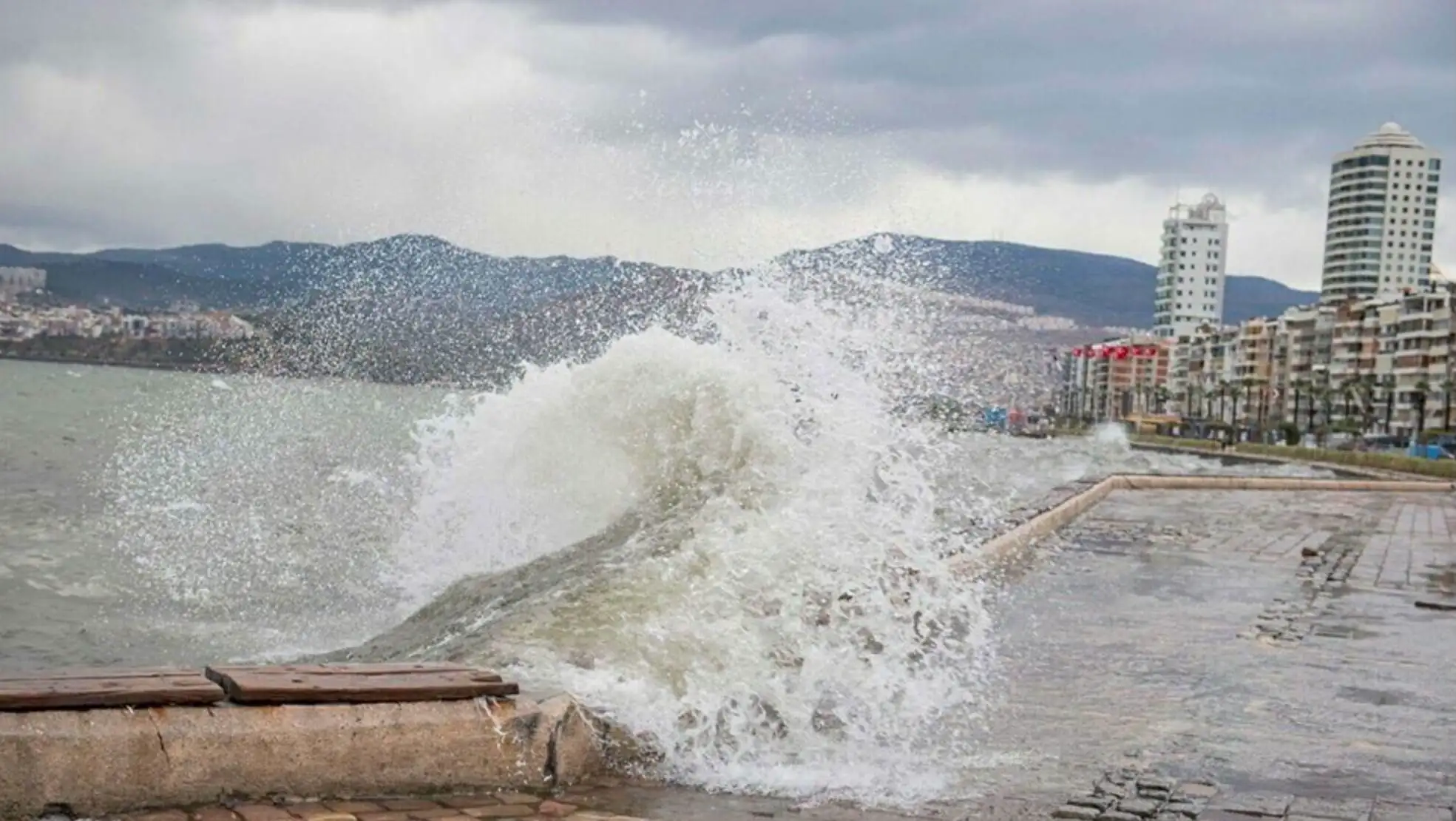 A wave crashing on a stone wall. A wave crashing on a stone wall.