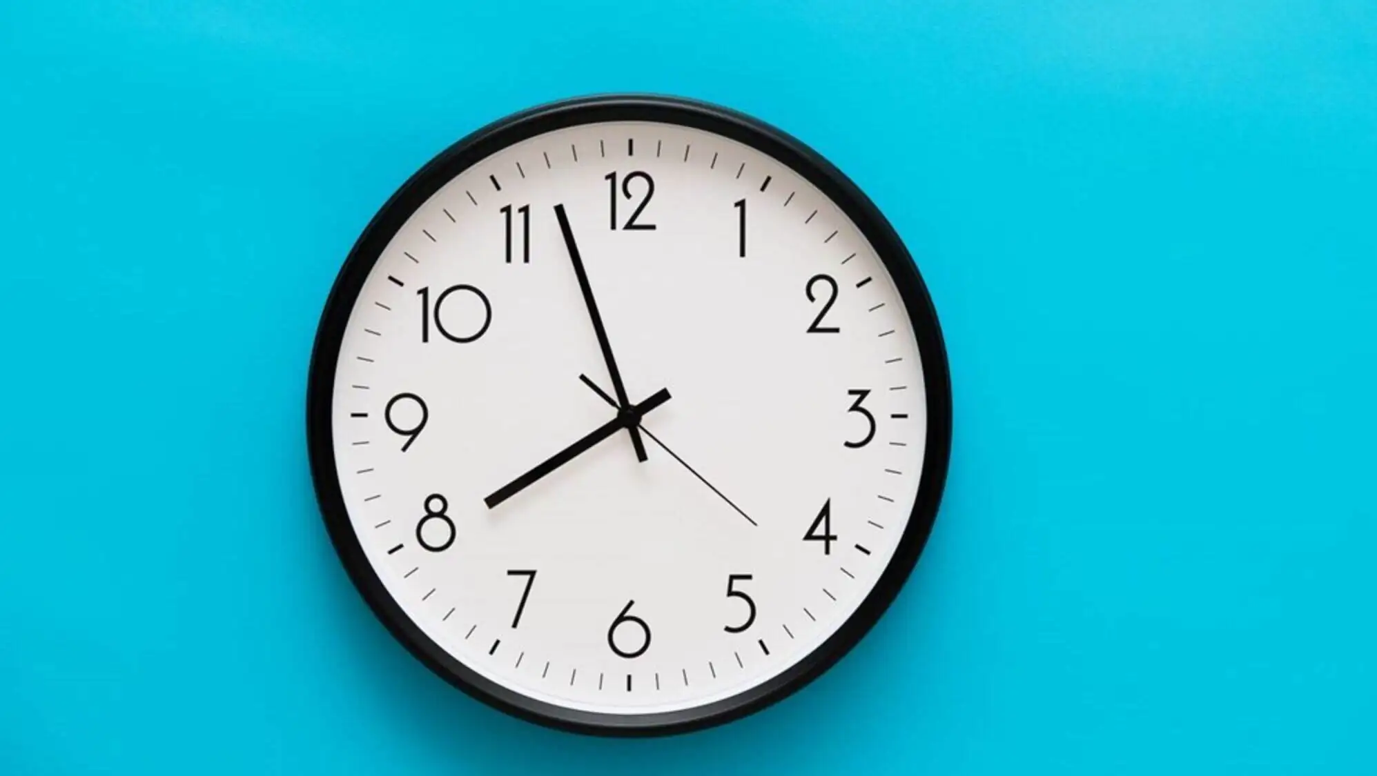 A clock on a blue wall A clock on a blue wall