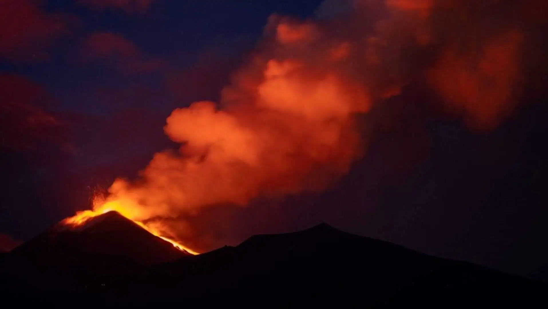 Lava and smoke erupting from the volcano. Lava and smoke erupting from the volcano.