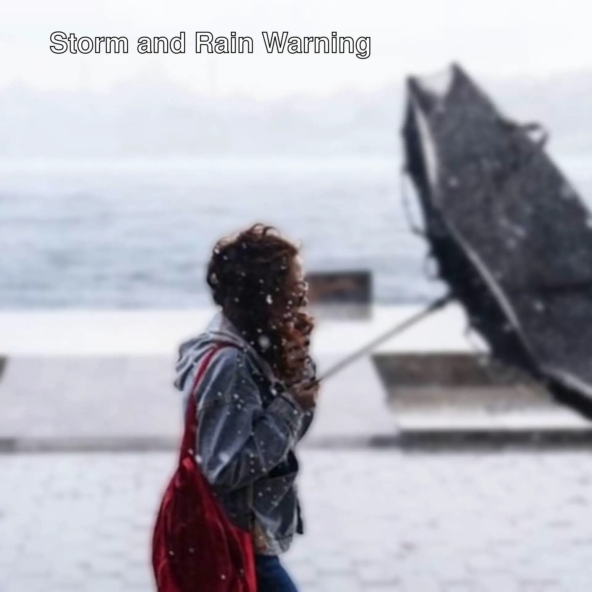 A woman holding an umbrella in the rain. A woman holding an umbrella in the rain.