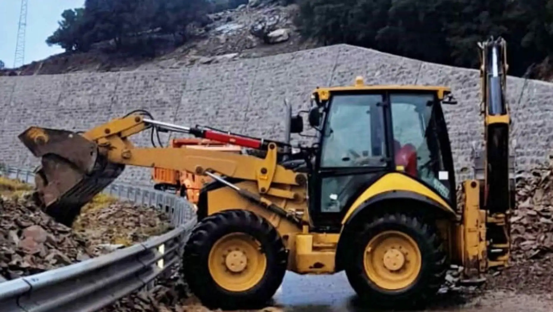 A tractor working on the road after flooding in Gökçeada. A tractor working on the road after flooding in Gökçeada.