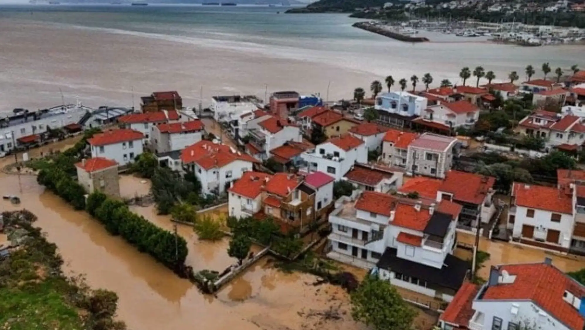 Houses submerged in water due to flooding. Houses submerged in water due to flooding.