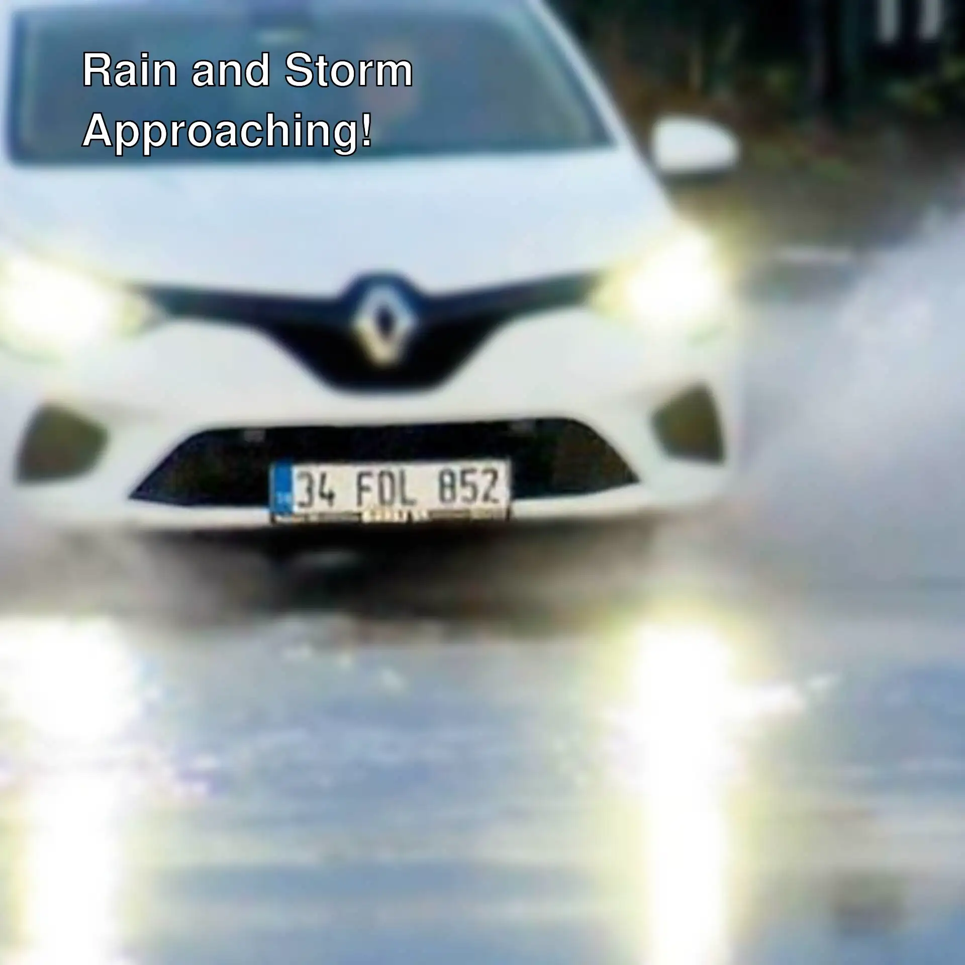 A car driving through a puddle. A car driving through a puddle.