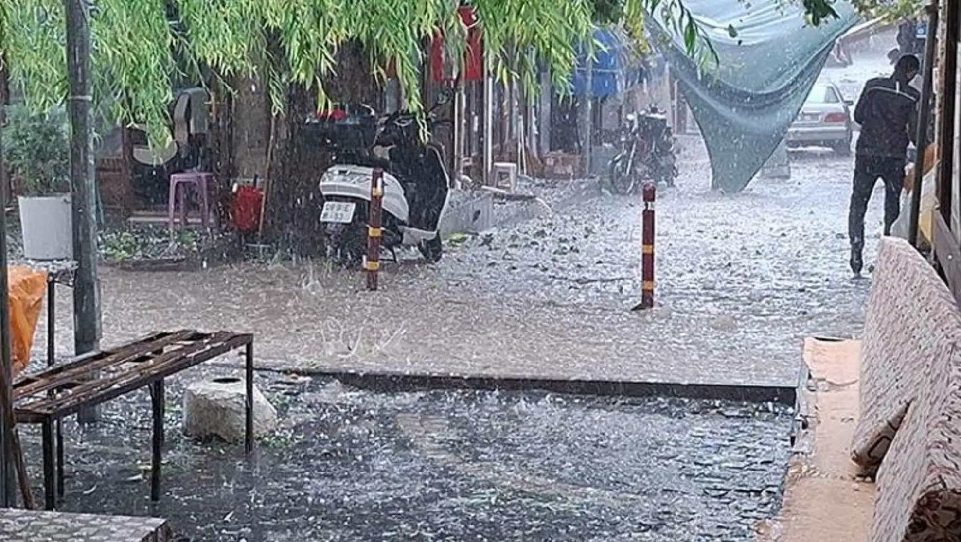 A motorcycle parked in a flooded area.