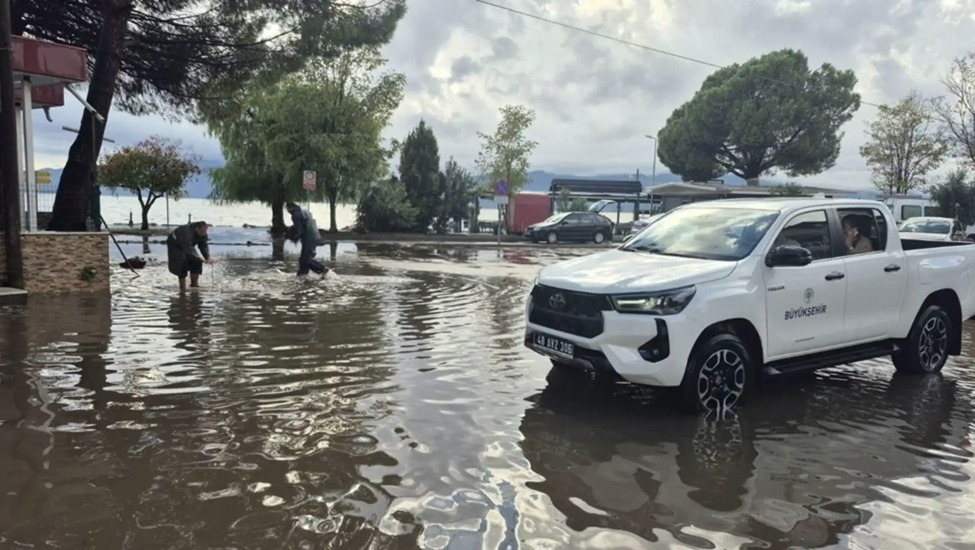 A car in a flooded street. A car in a flooded street.