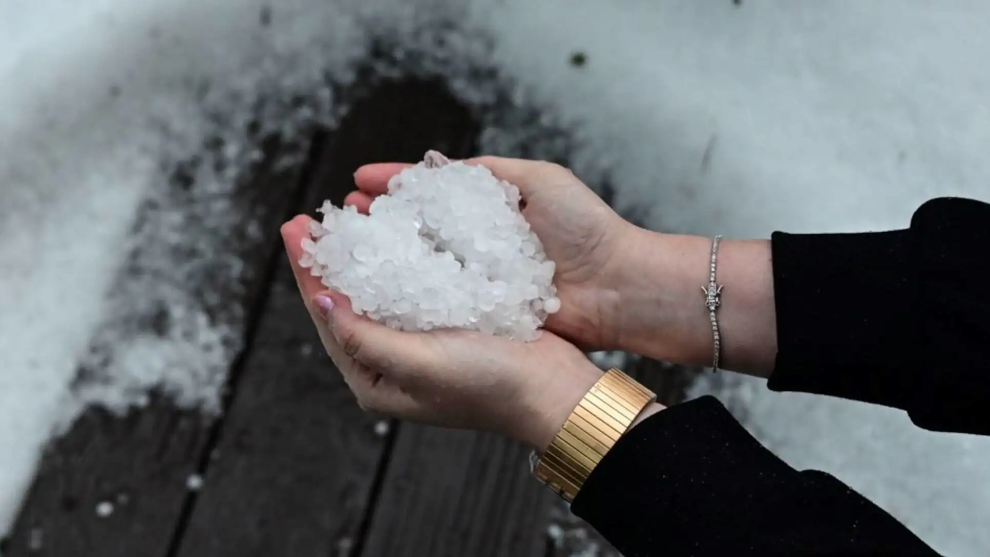 A person holding hail. A person holding hail.