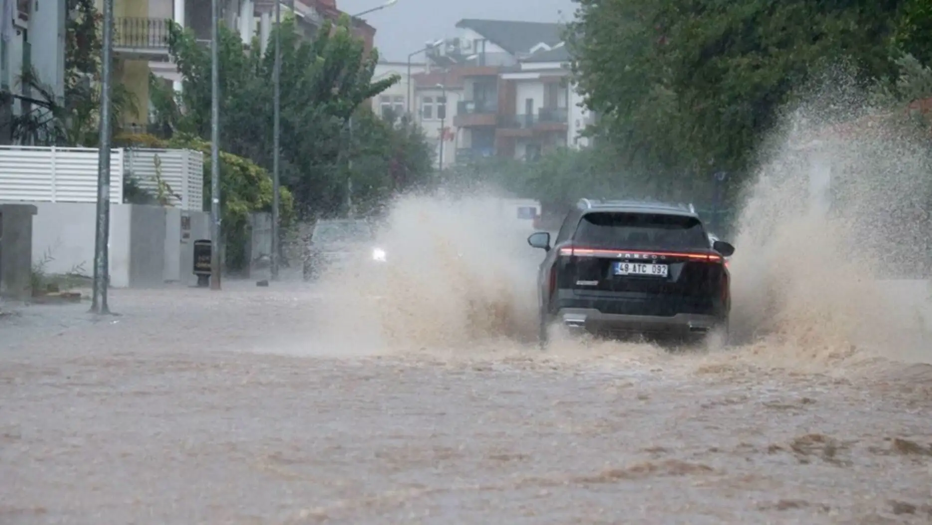 A flooded road. A flooded road.
