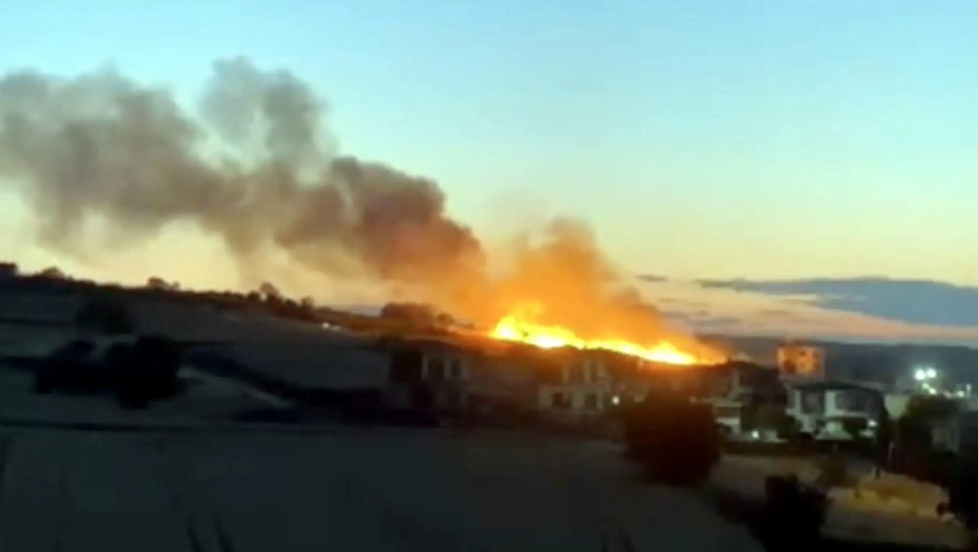 Flames rising during a fire.