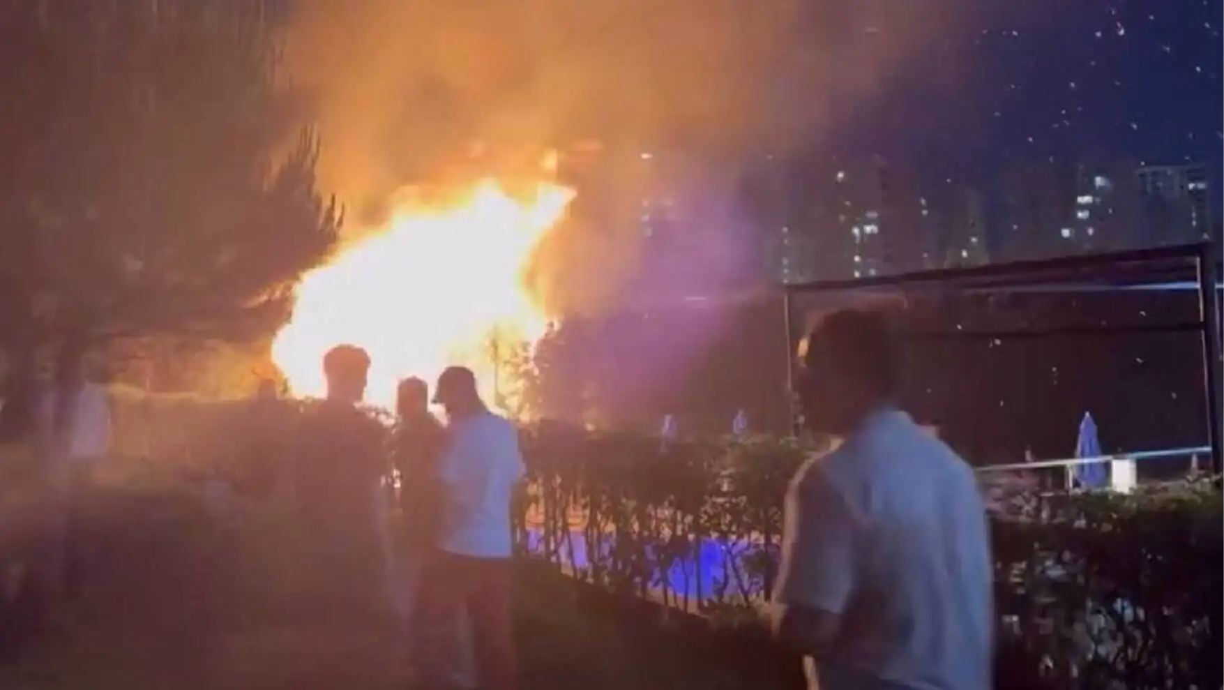 People gathered around a fire.