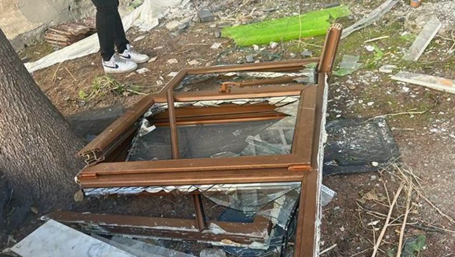 Broken windows and damaged areas. Broken windows and damaged areas.