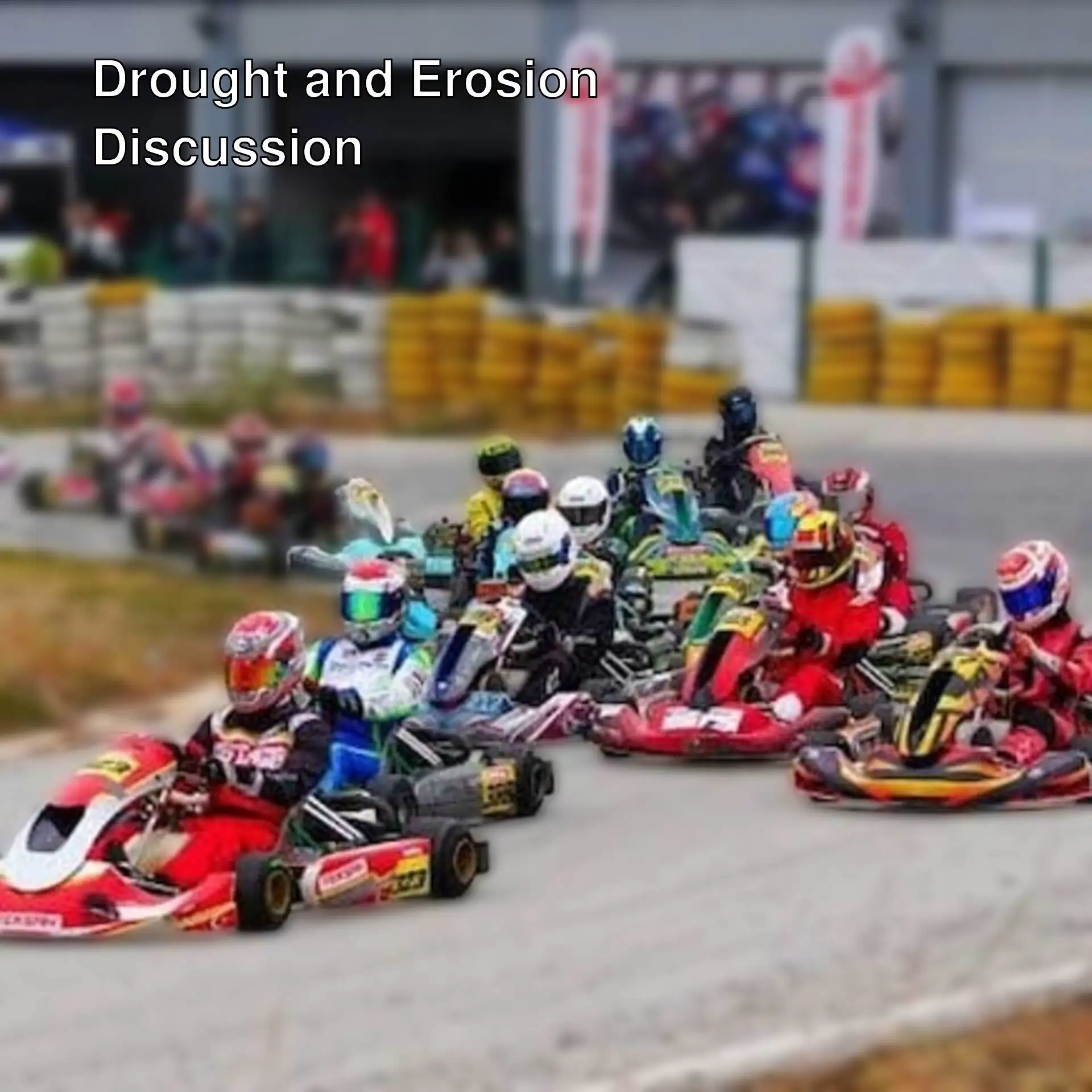A group of people racing in go-karts. A group of people racing in go-karts.