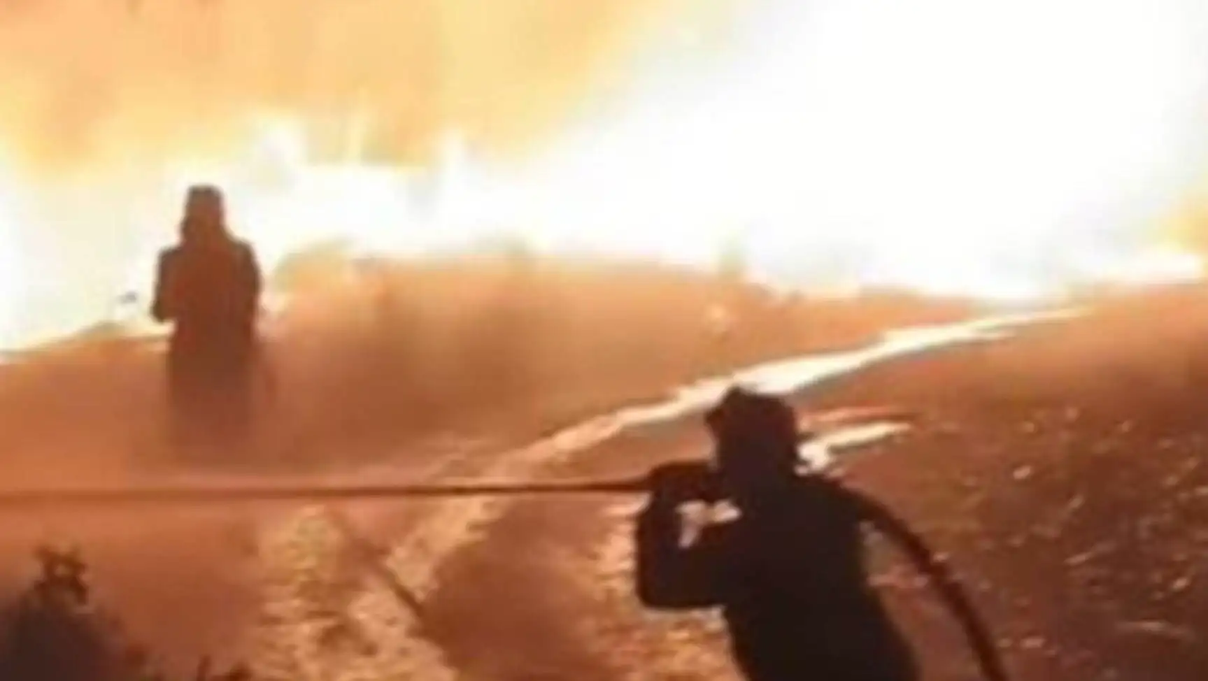 A fire in the background.