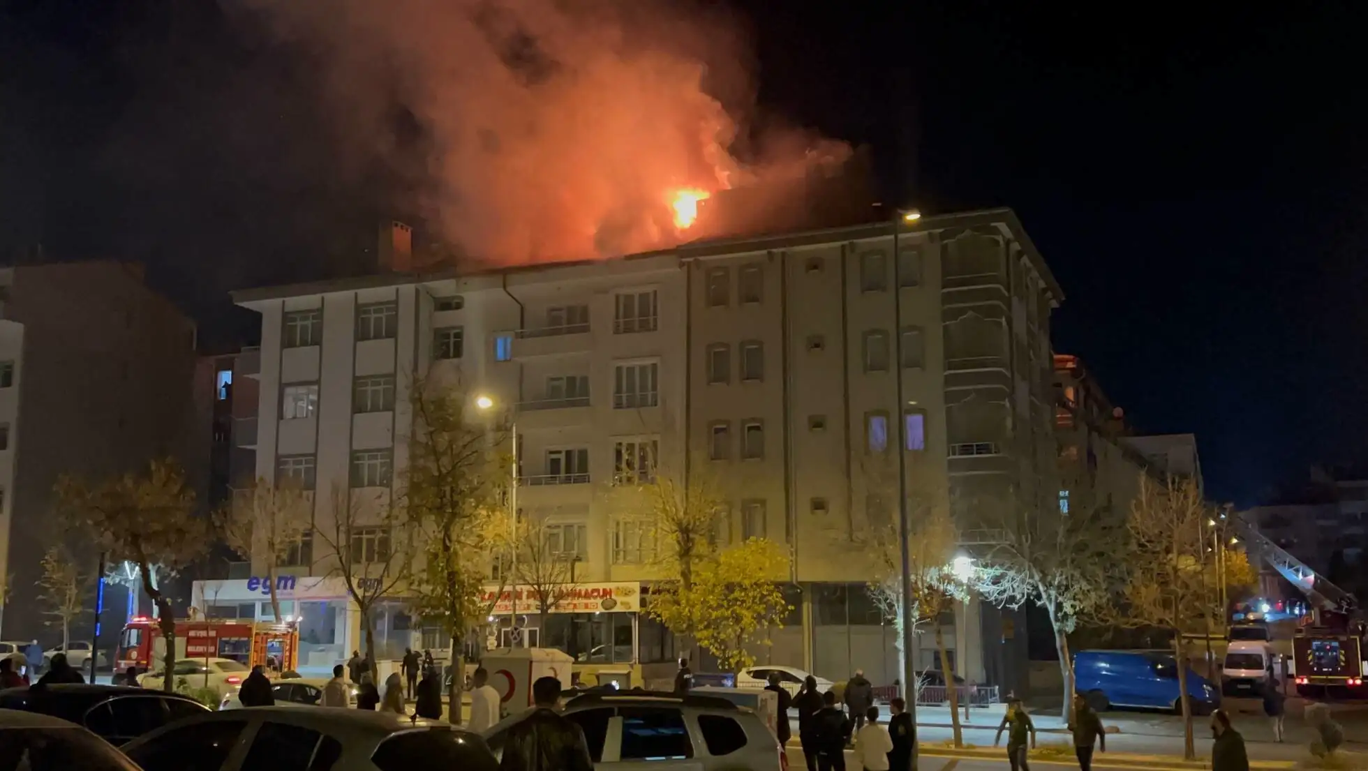 People around the building on fire.