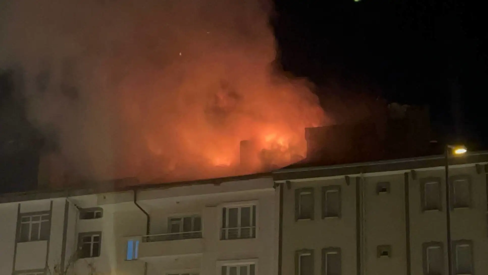 Building on fire at night.