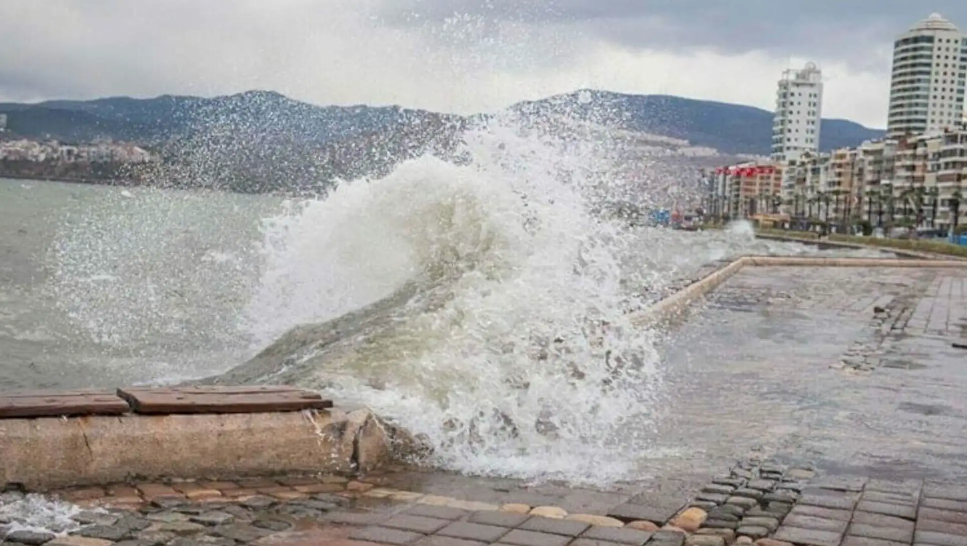 A wave crashing into a stone wall A wave crashing into a stone wall