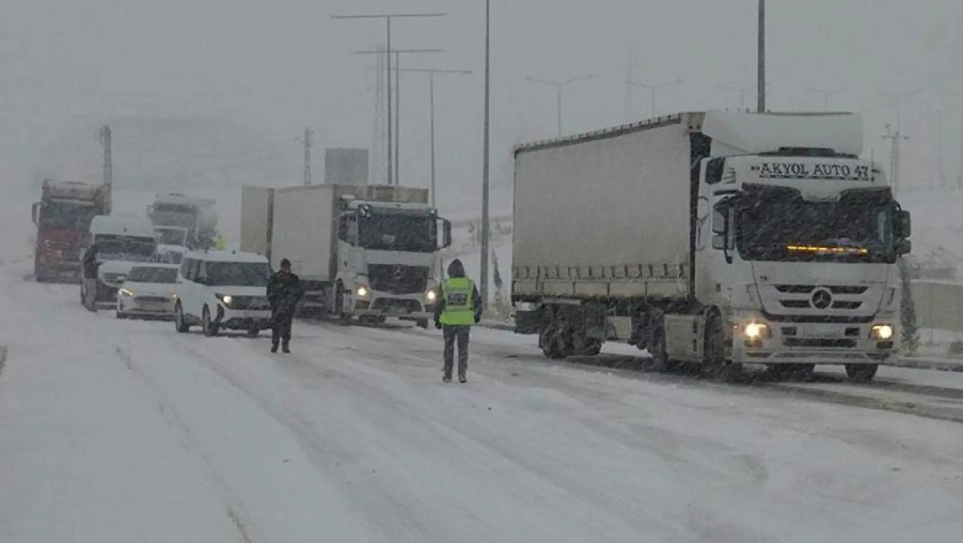 Roads closed due to snowfall, vehicles stranded. Roads closed due to snowfall, vehicles stranded.