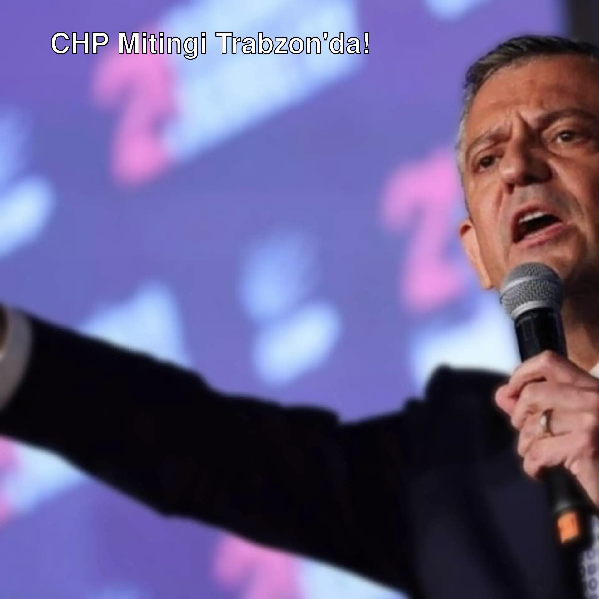CHP lideri Özgür Özel, mitingde mikrofonla konuşuyor. CHP lideri Özgür Özel, mitingde mikrofonla konuşuyor.