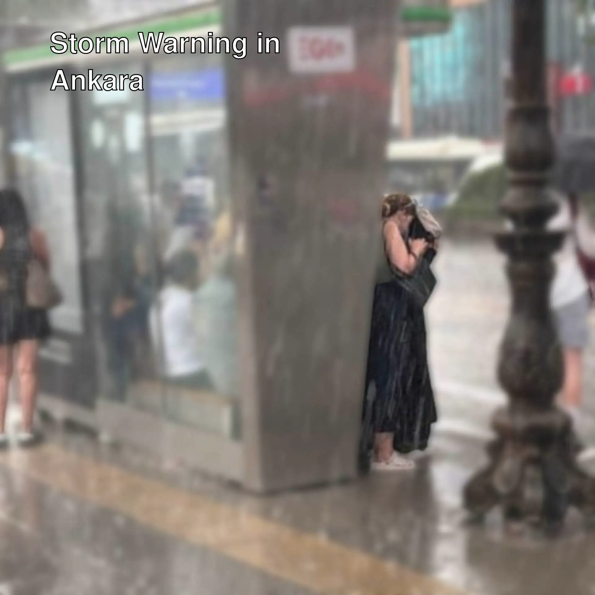 People standing in the rain.