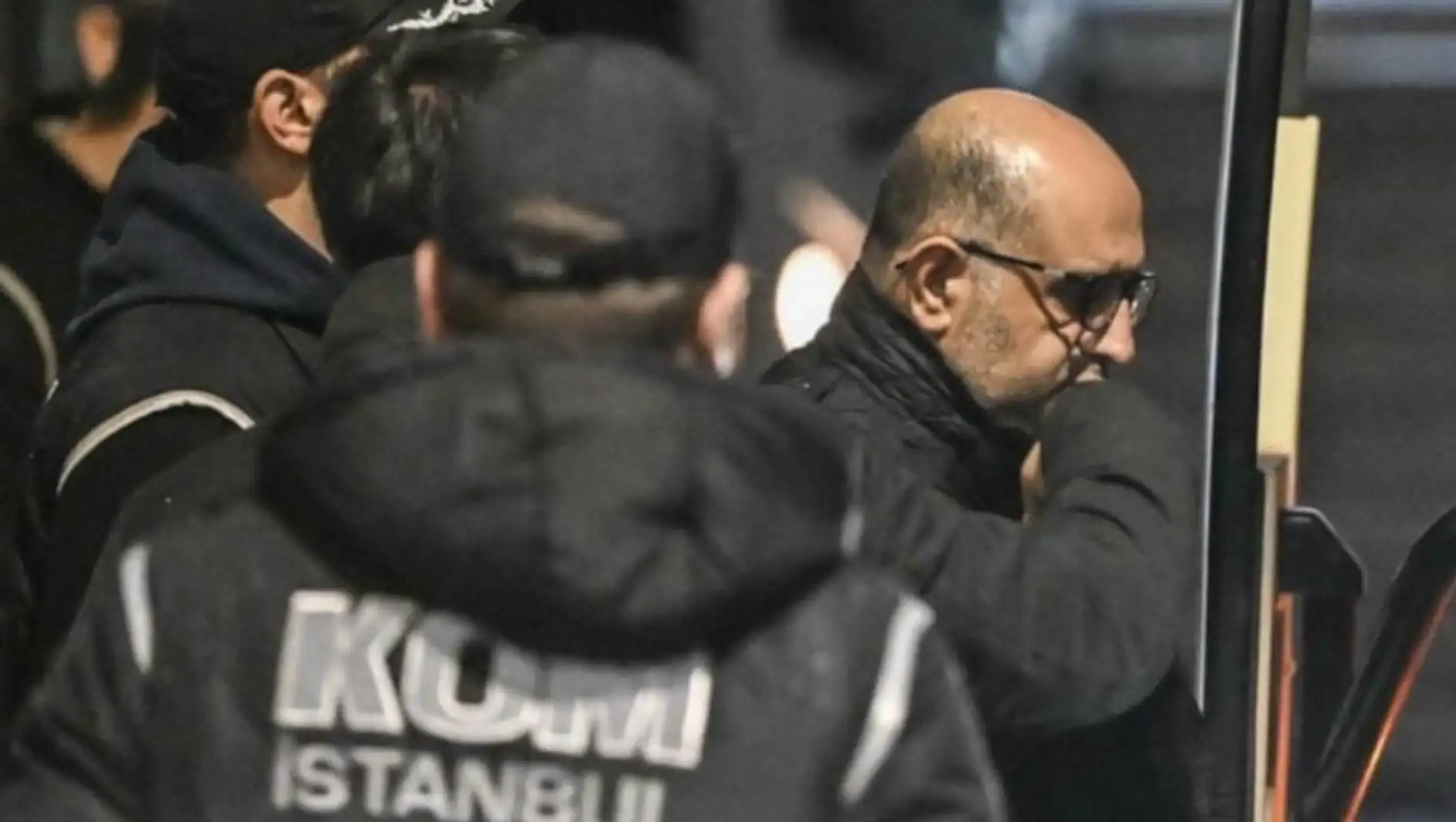 A man in a black jacket with a thoughtful expression. A man in a black jacket with a thoughtful expression.