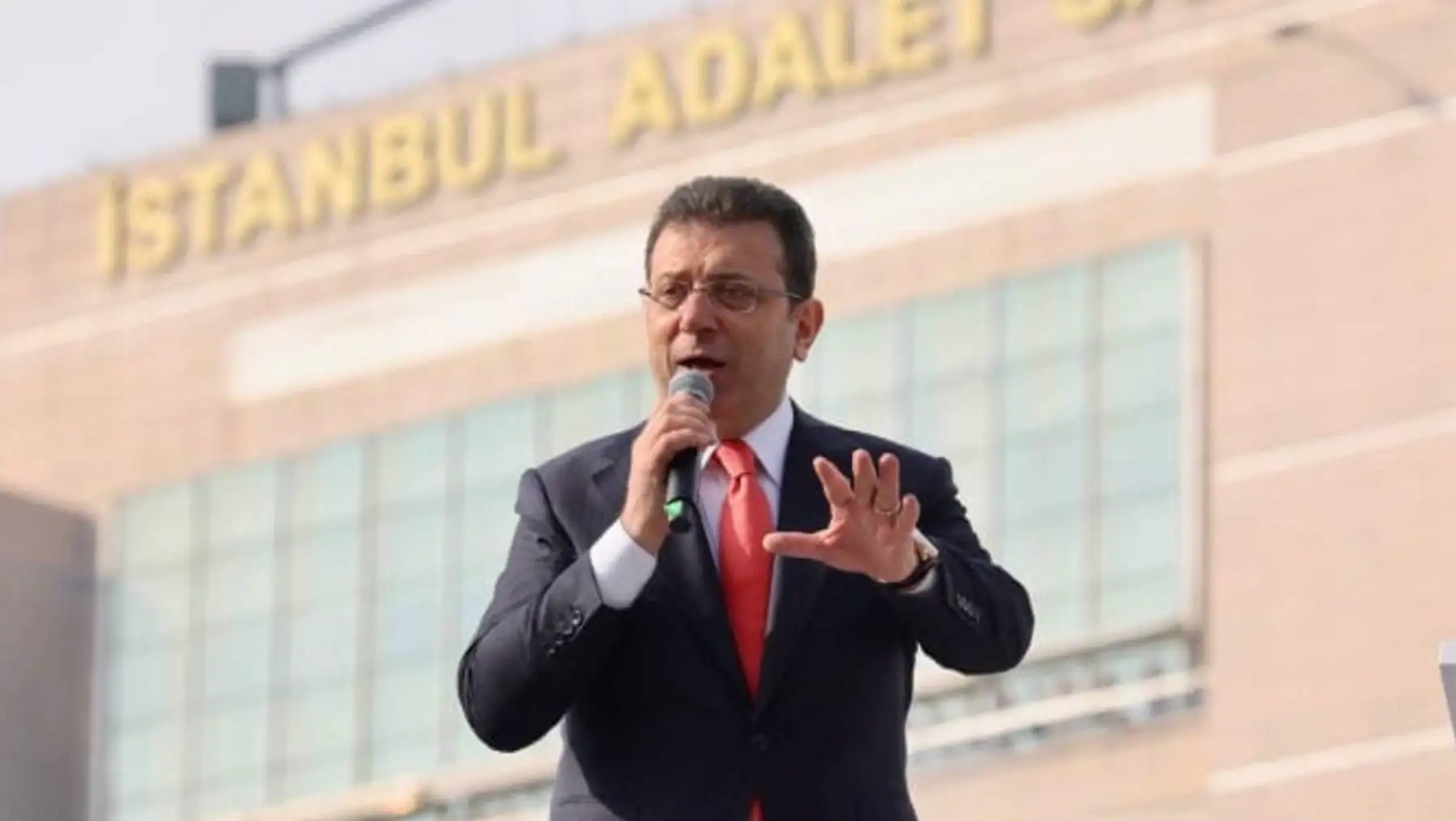 Ekrem İmamoğlu speaking at a press conference.