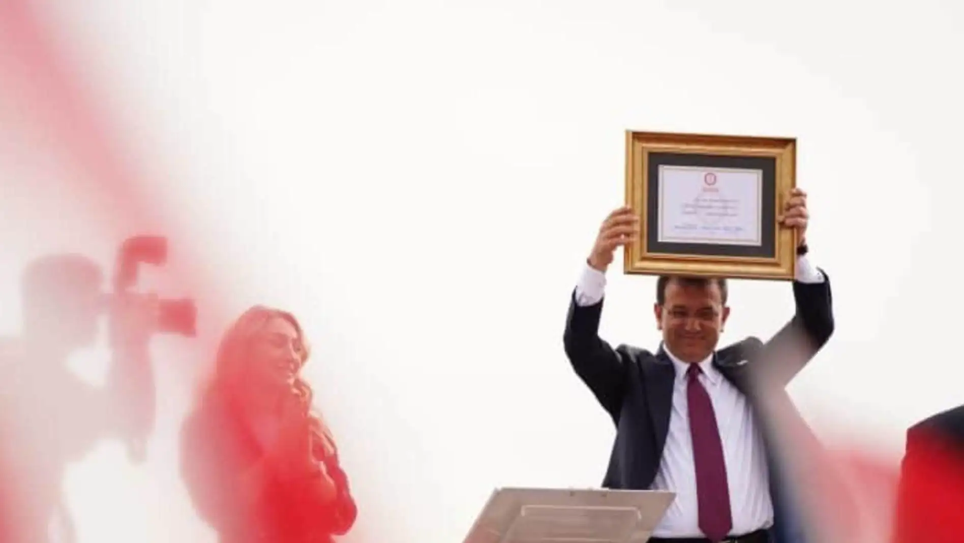 Ekrem İmamoğlu making statements at a press conference.