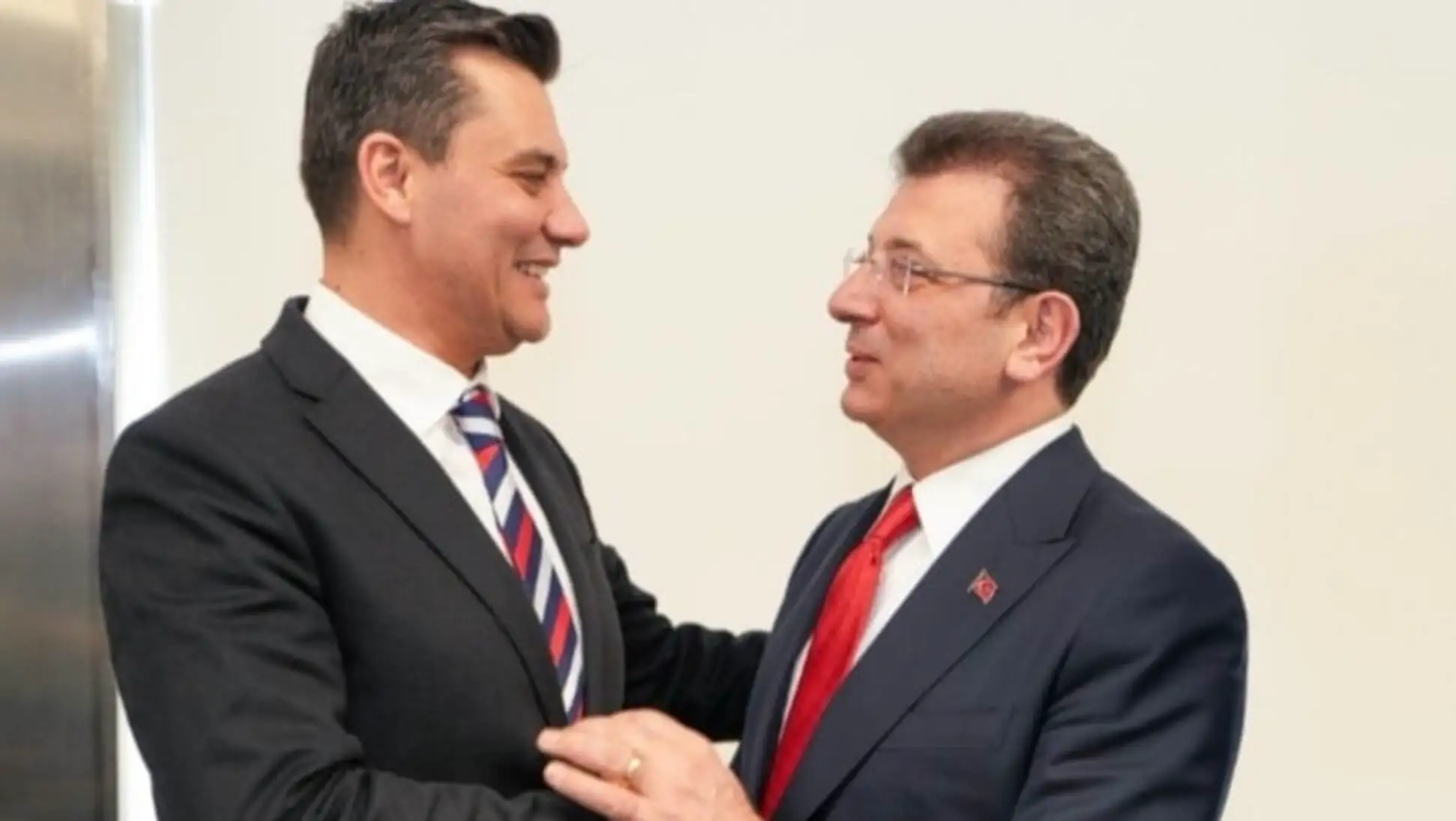 Two men in suits. Two men in suits.