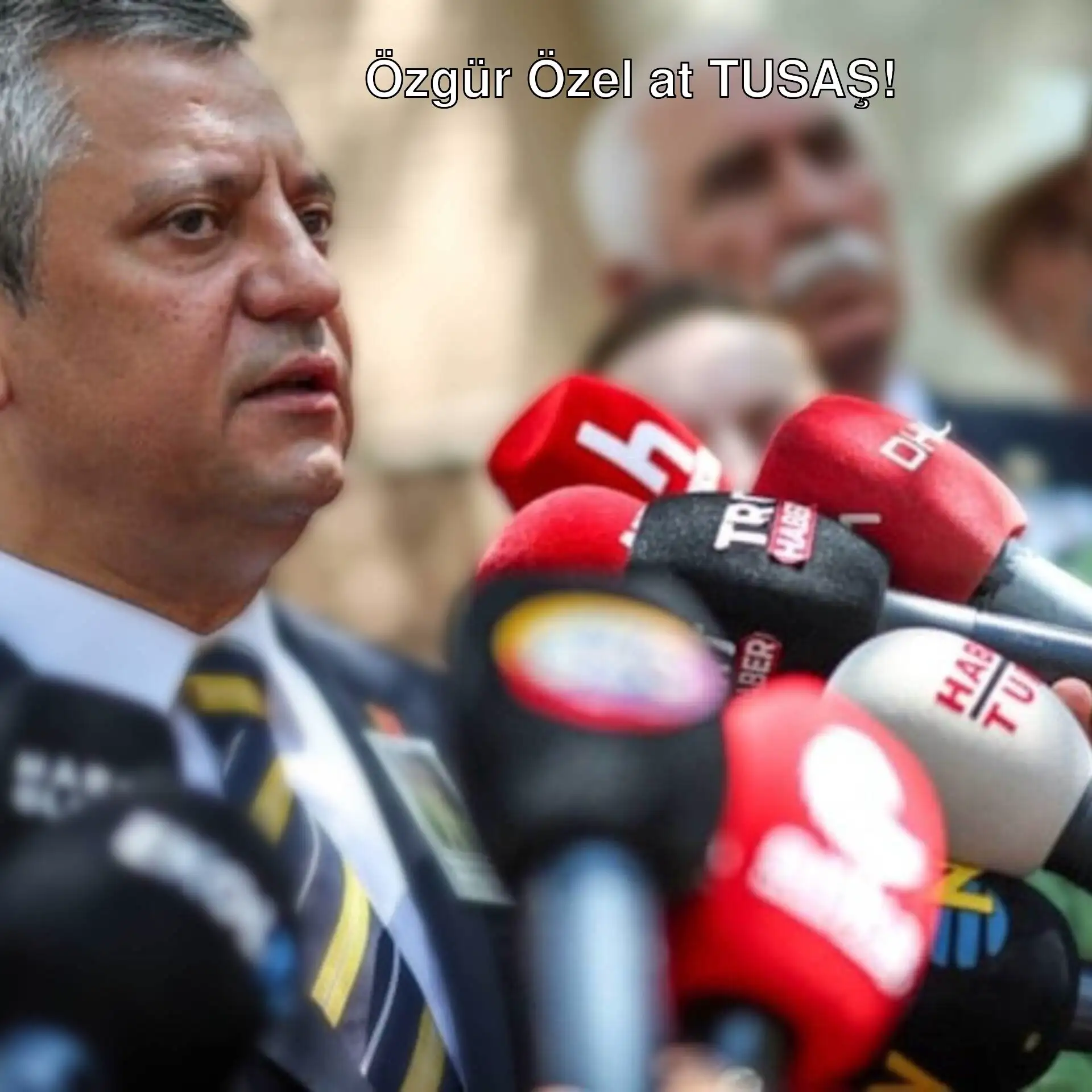 Özgür Özel holding a microphone during his visit to TUSAŞ. Özgür Özel holding a microphone during his visit to TUSAŞ.