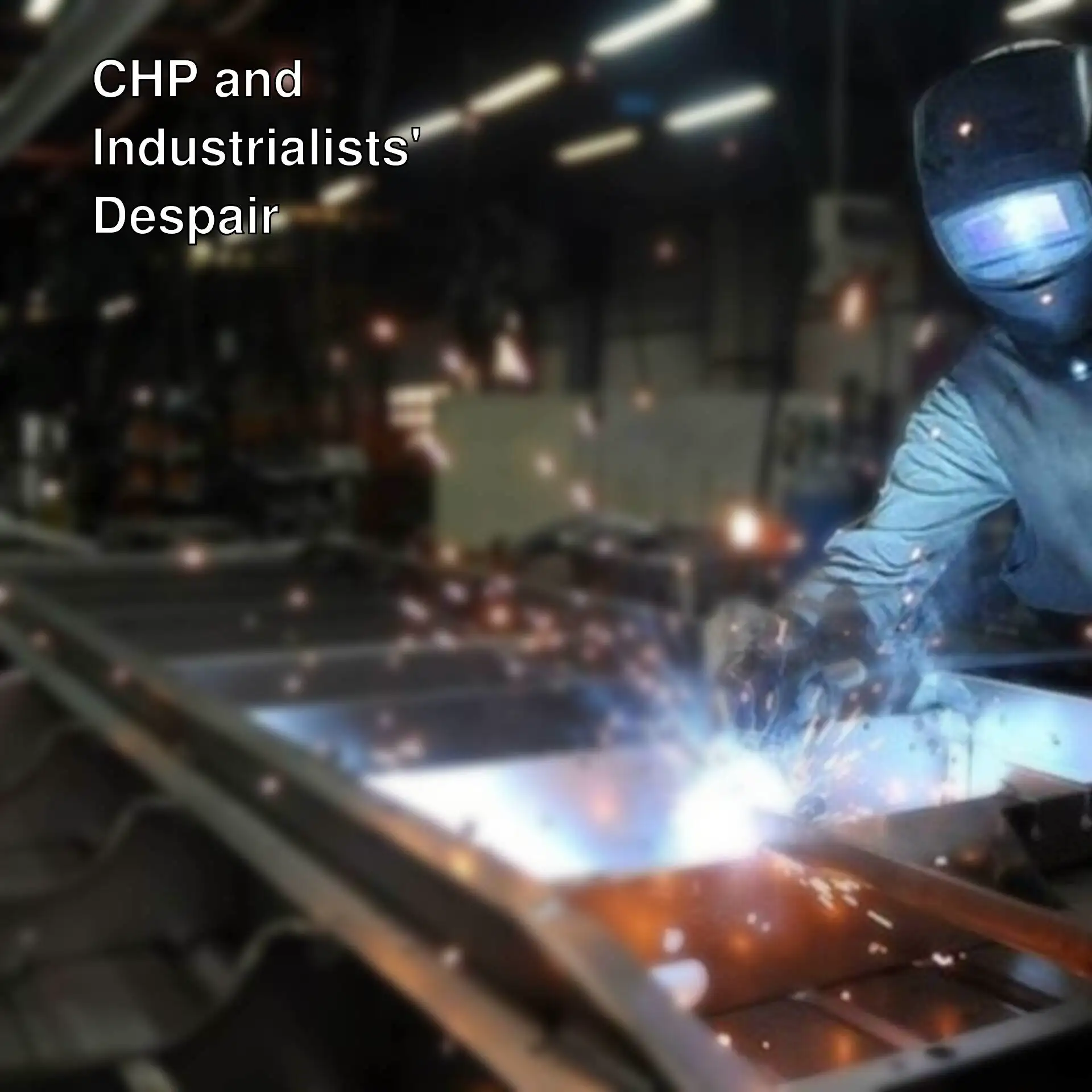 A man welding a piece of metal. A man welding a piece of metal.