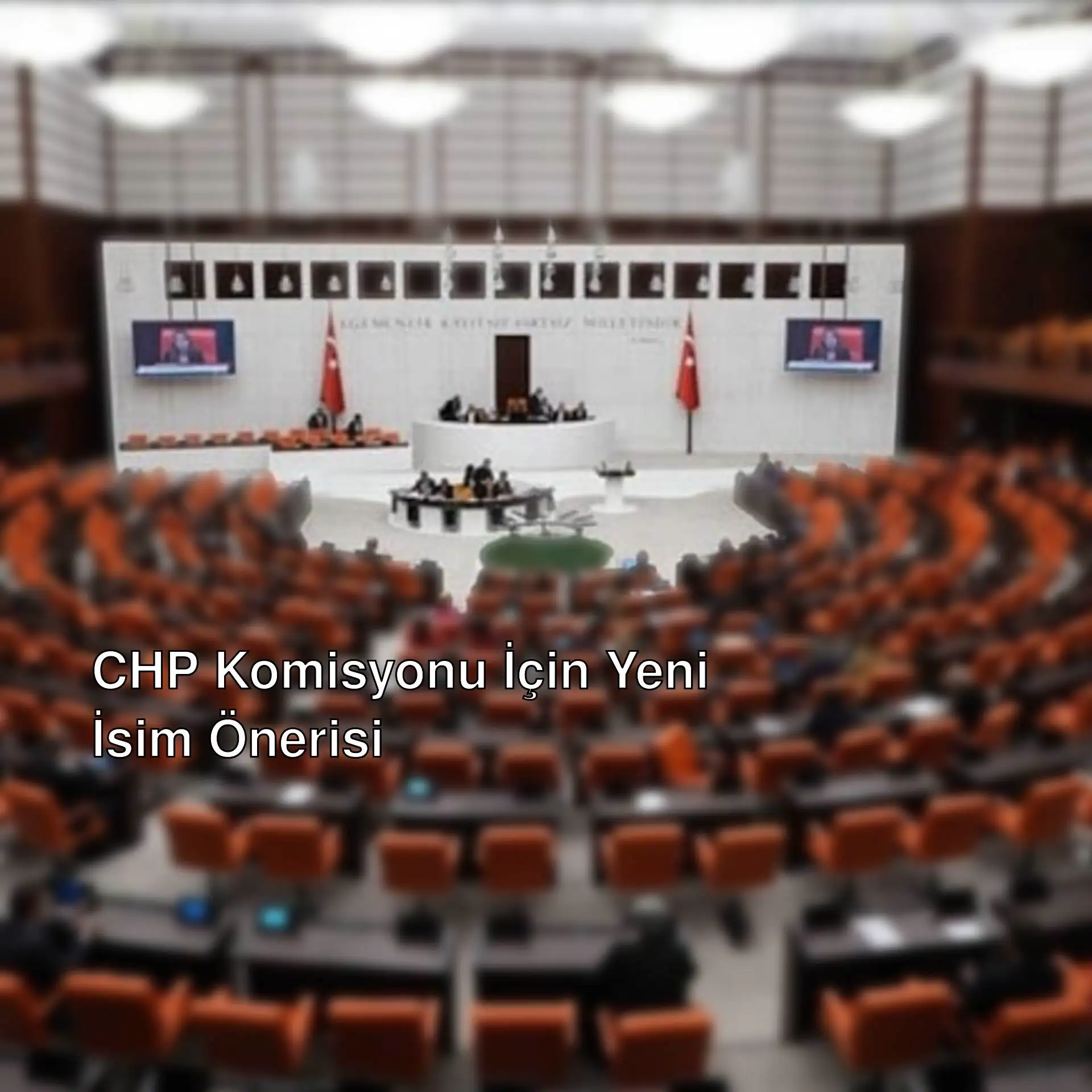 Büyük yuvarlak bir oda, turuncu sandalyelerle dolu.