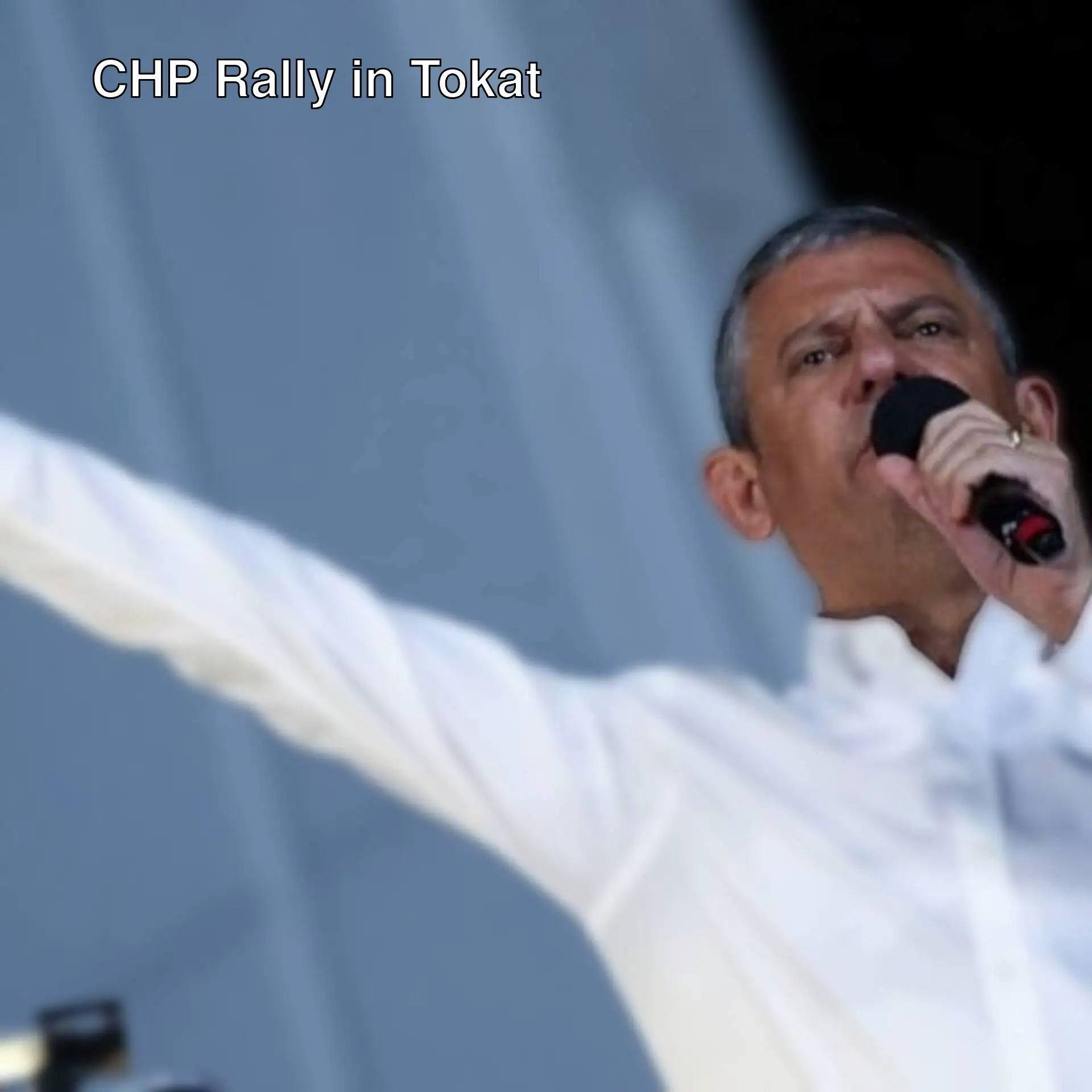 A man holding a microphone at the CHP rally. A man holding a microphone at the CHP rally.
